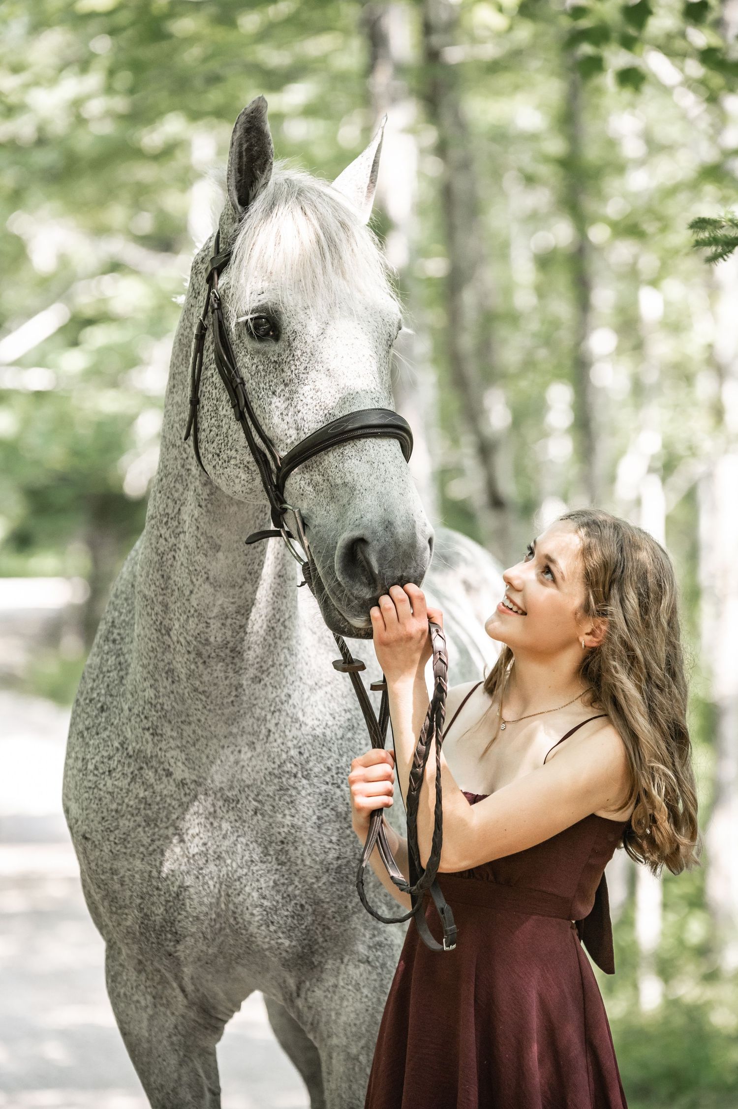 girl smiling with horse