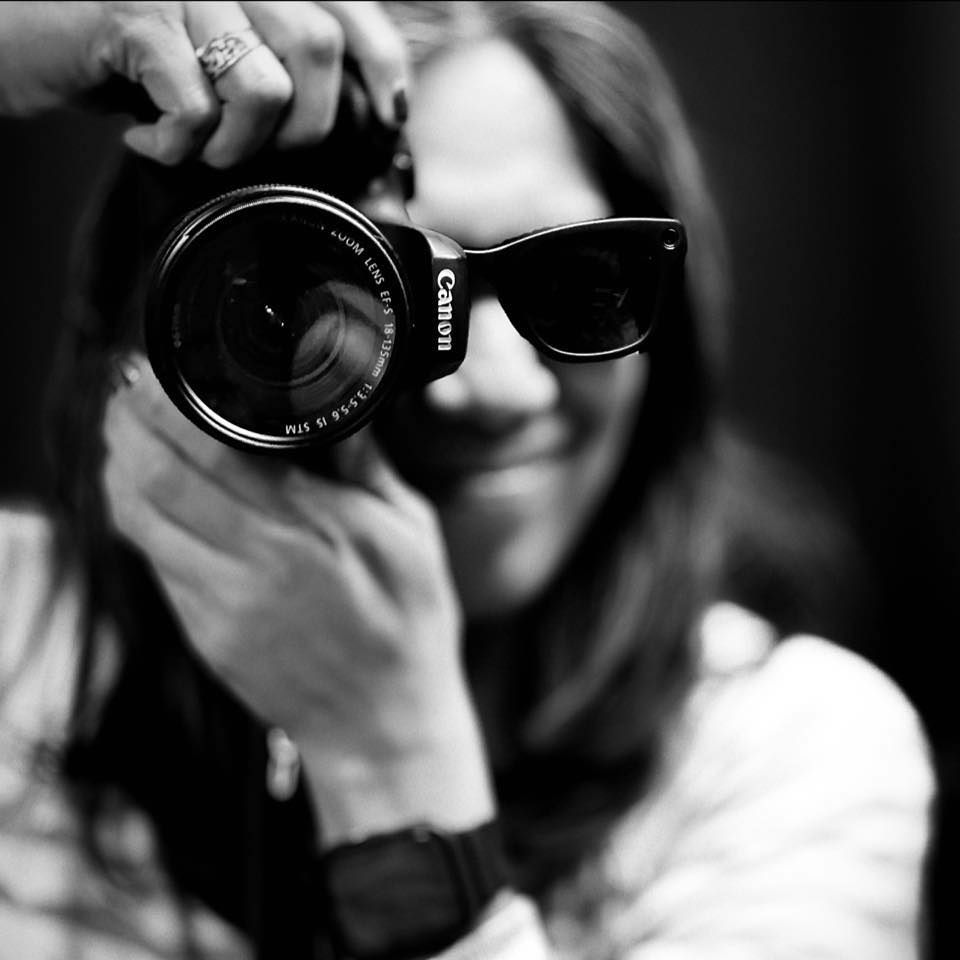 Black and white close-up shots of photographers holding cameras in sequence.