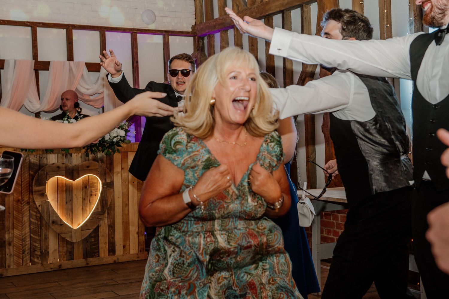 Joyful celebration with guests dancing and enjoying the wedding reception.