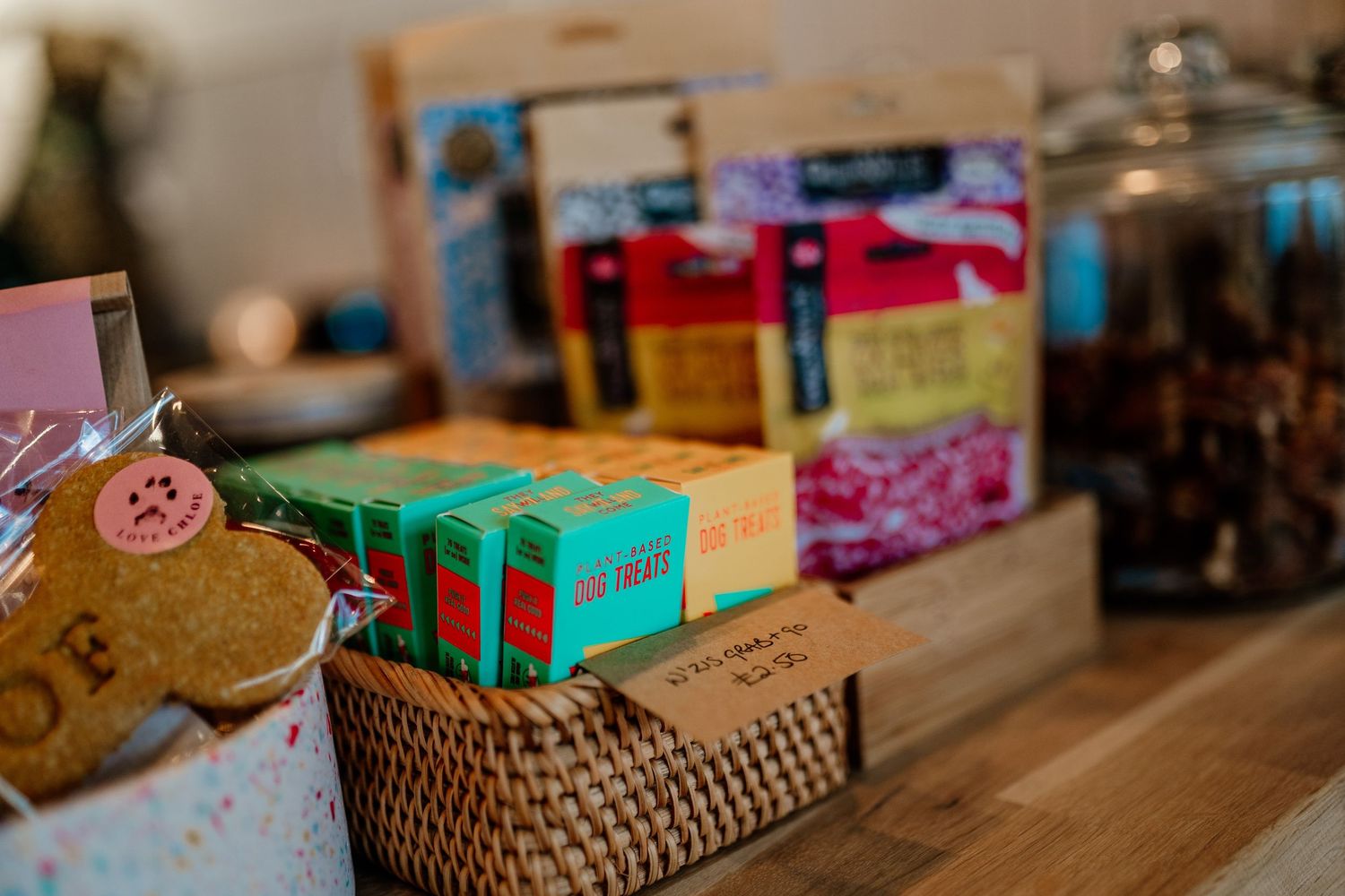 Retail display shelf with colorful product boxes and baskets arranged neatly.