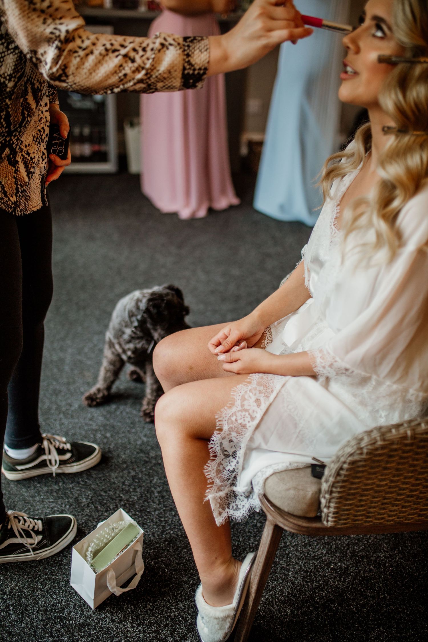 Wedding preparation scene with lace robe and casual sneakers visible.