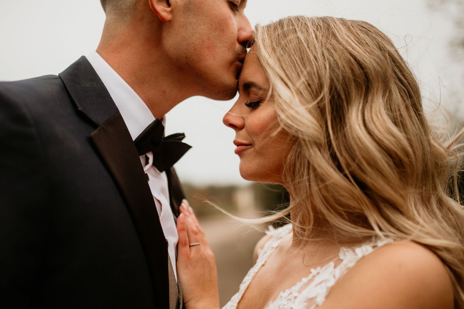 Romantic wedding couple shares intimate moments in a series of black and white photographs.