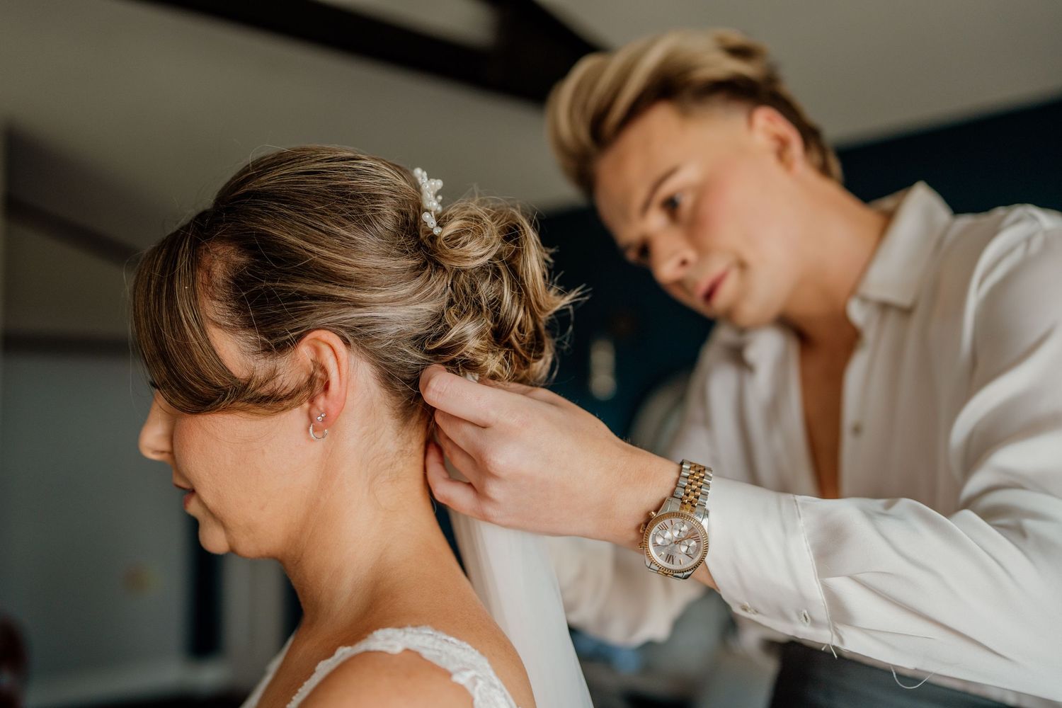 Wedding preparation moments captured in an elegant indoor setting.