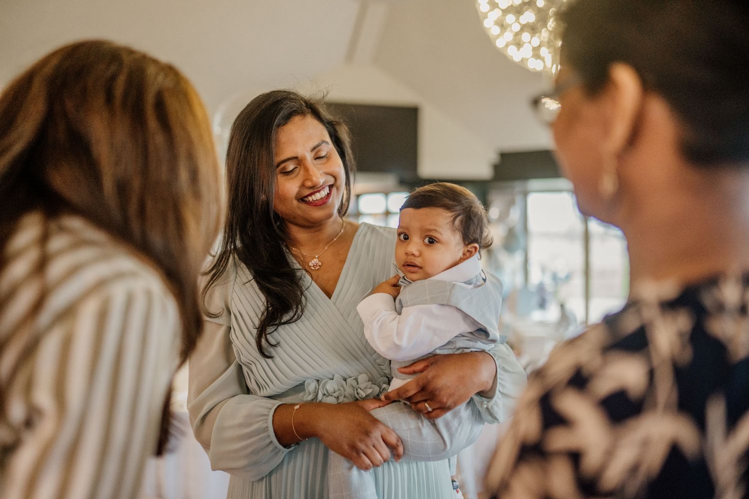 Guests sharing warm moments and embraces at a special celebration.