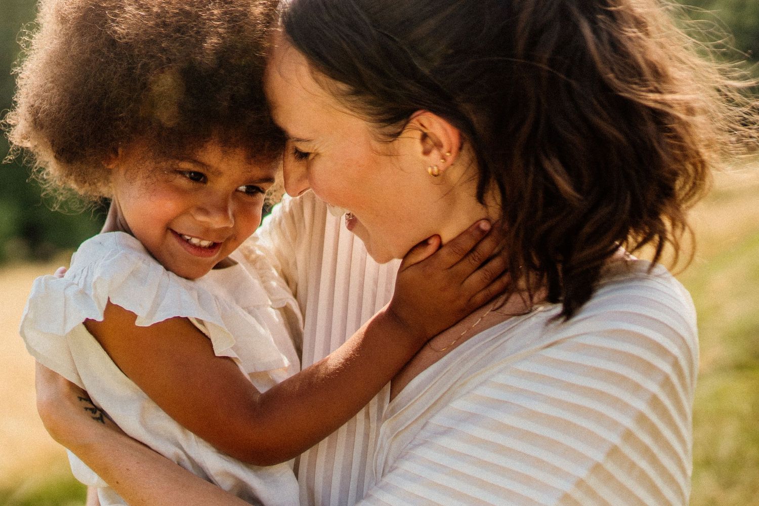 Tender family moment shared between loved ones on sunny afternoon.