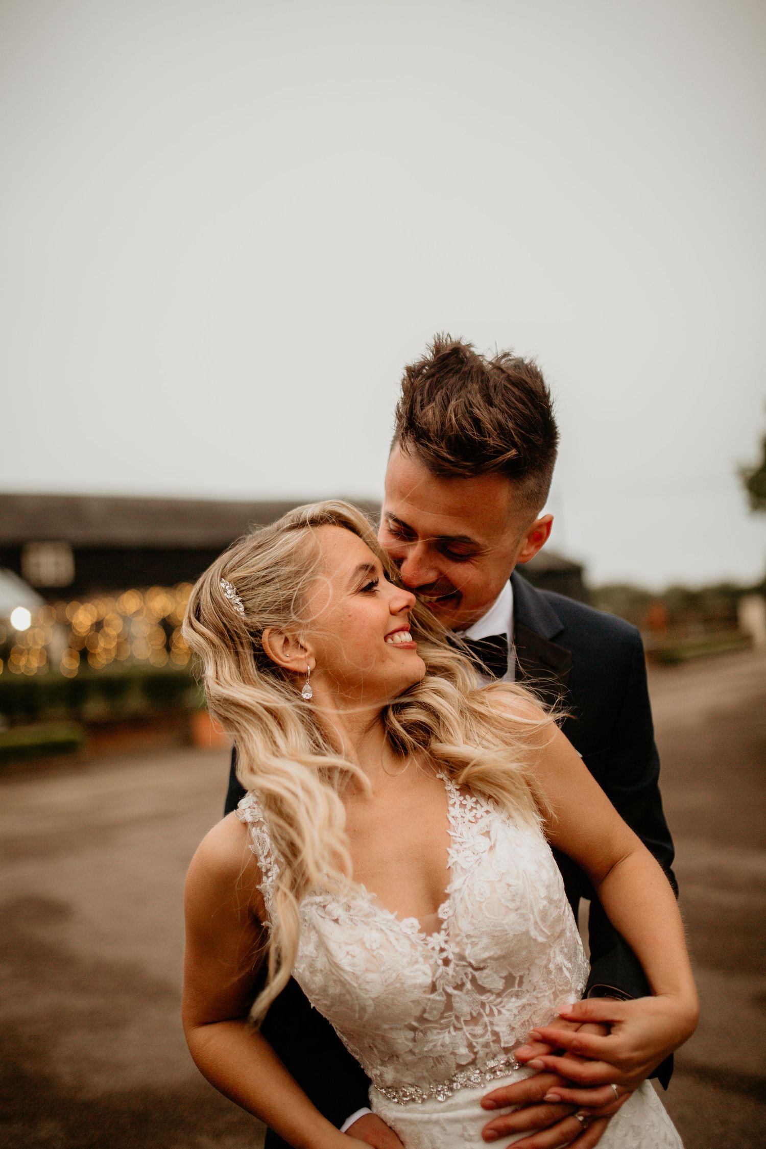 Joyful newlyweds laughing and embracing in a series of casual outdoor wedding photos.