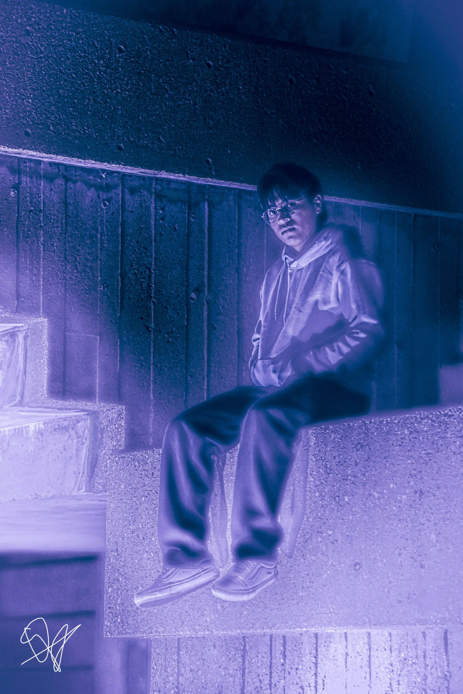 Figure in motion captured in purple-tinted lighting against a dark urban background.