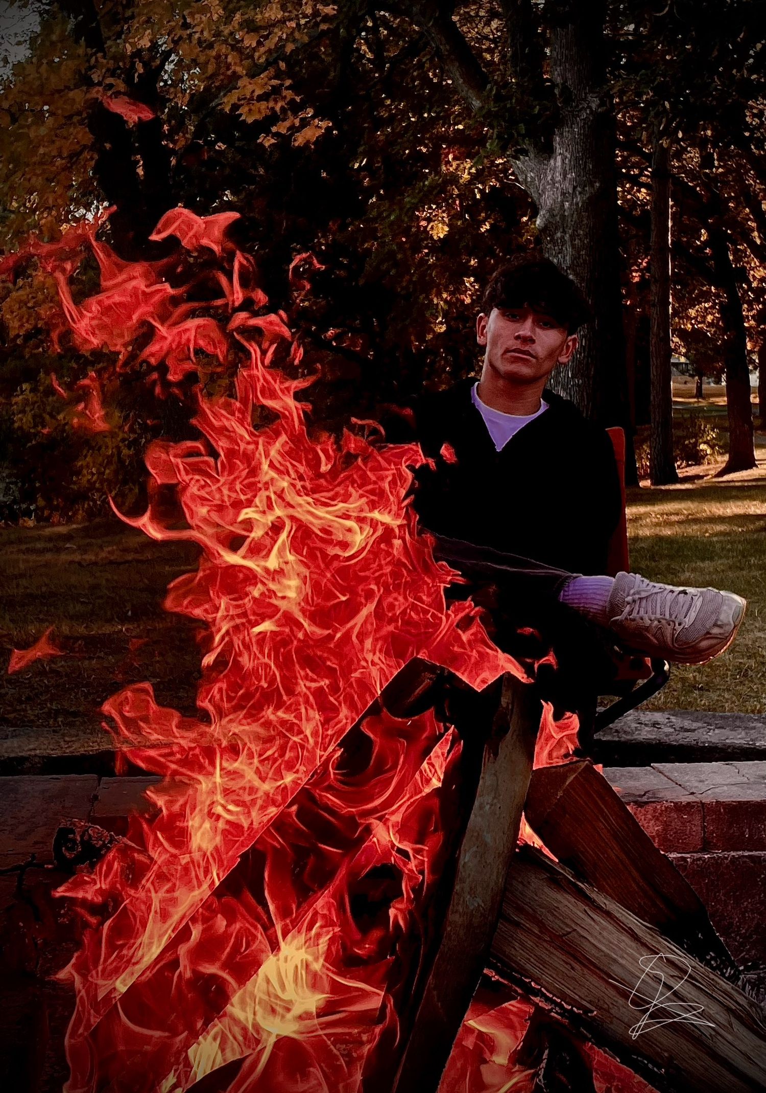 Bright red flames and fire effects in a dark outdoor setting.