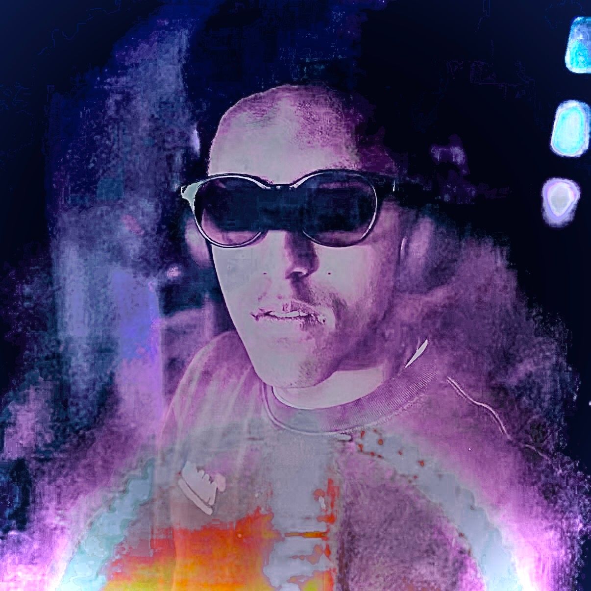 Abstract artistic portrait with neon colors and smoky effects against dark background.