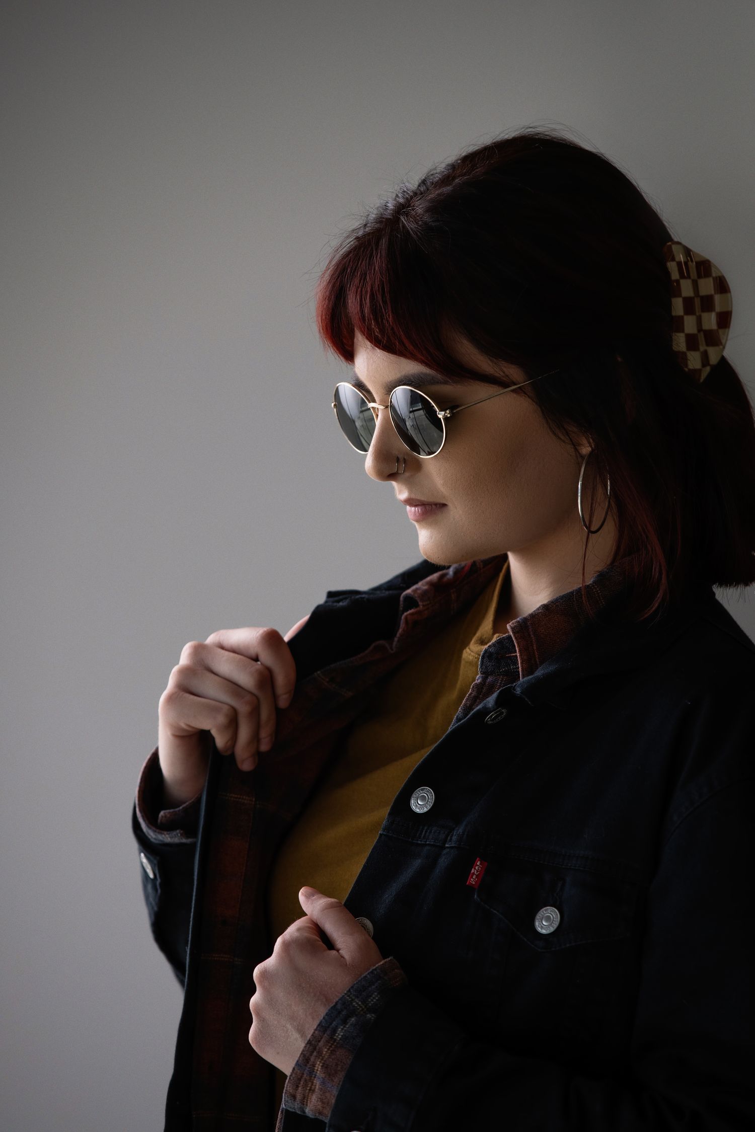 female in glasses and jean jacket