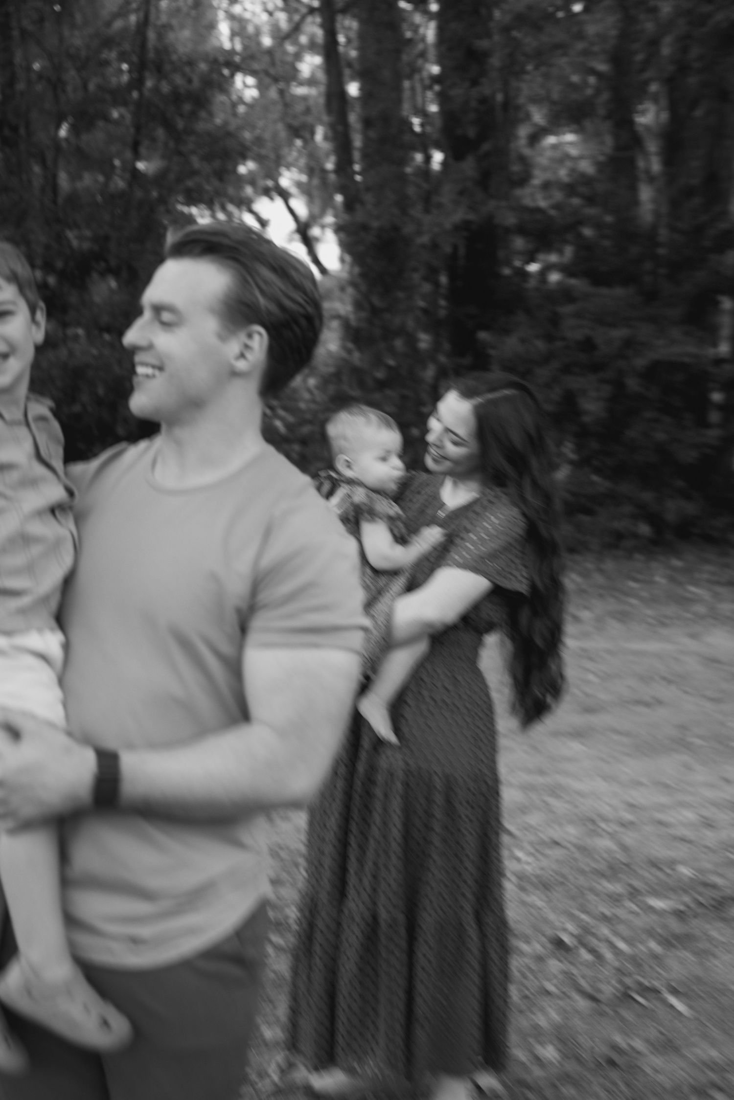 Black and white family portrait outdoors