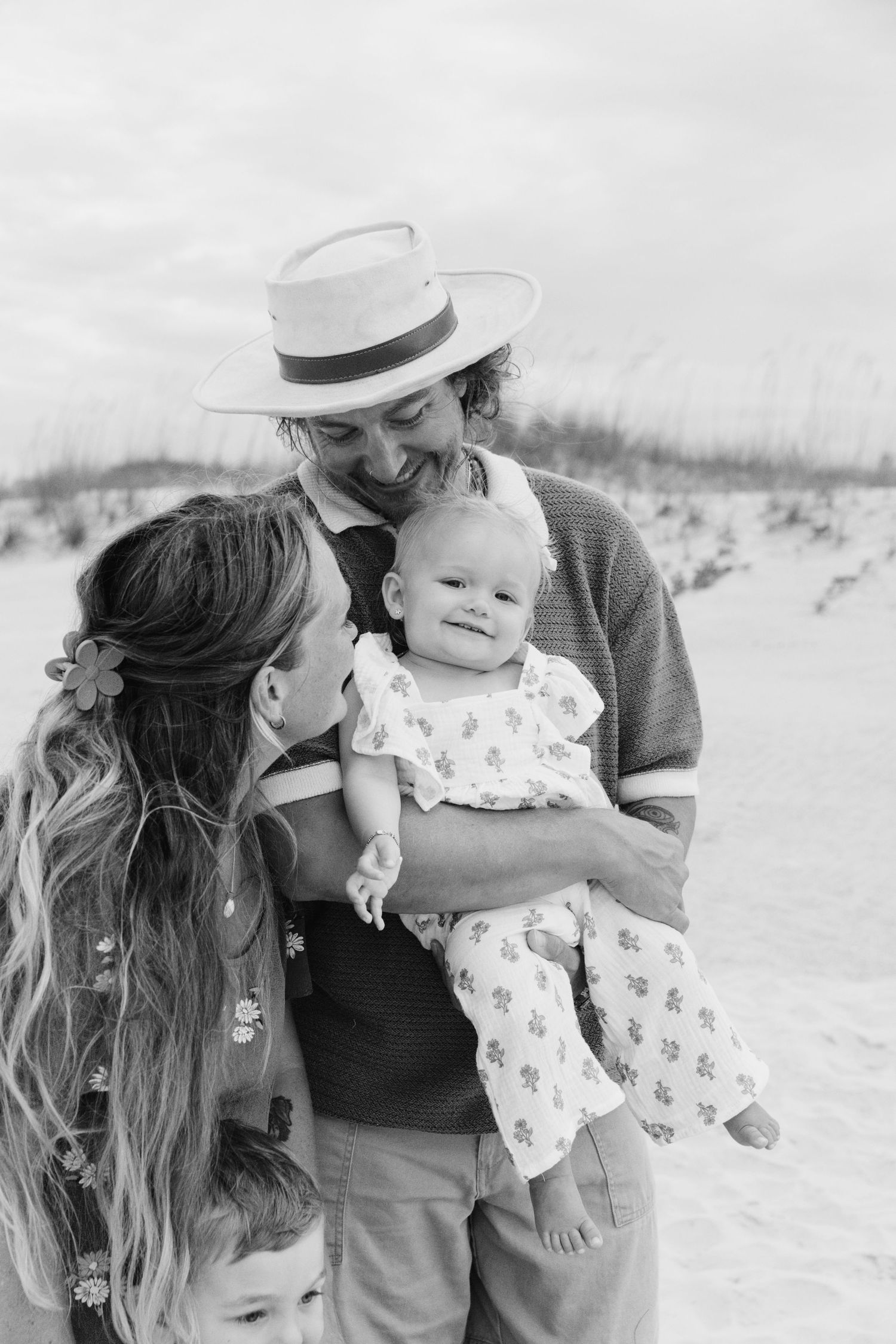 Family portrait on the beach in black and white