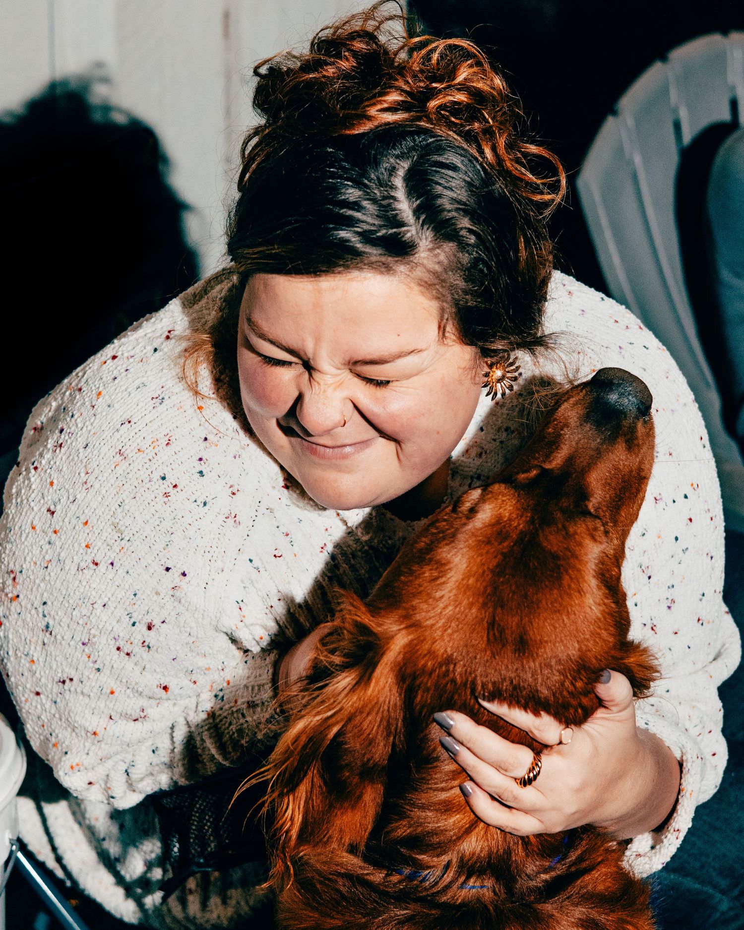 Female hugging a dog