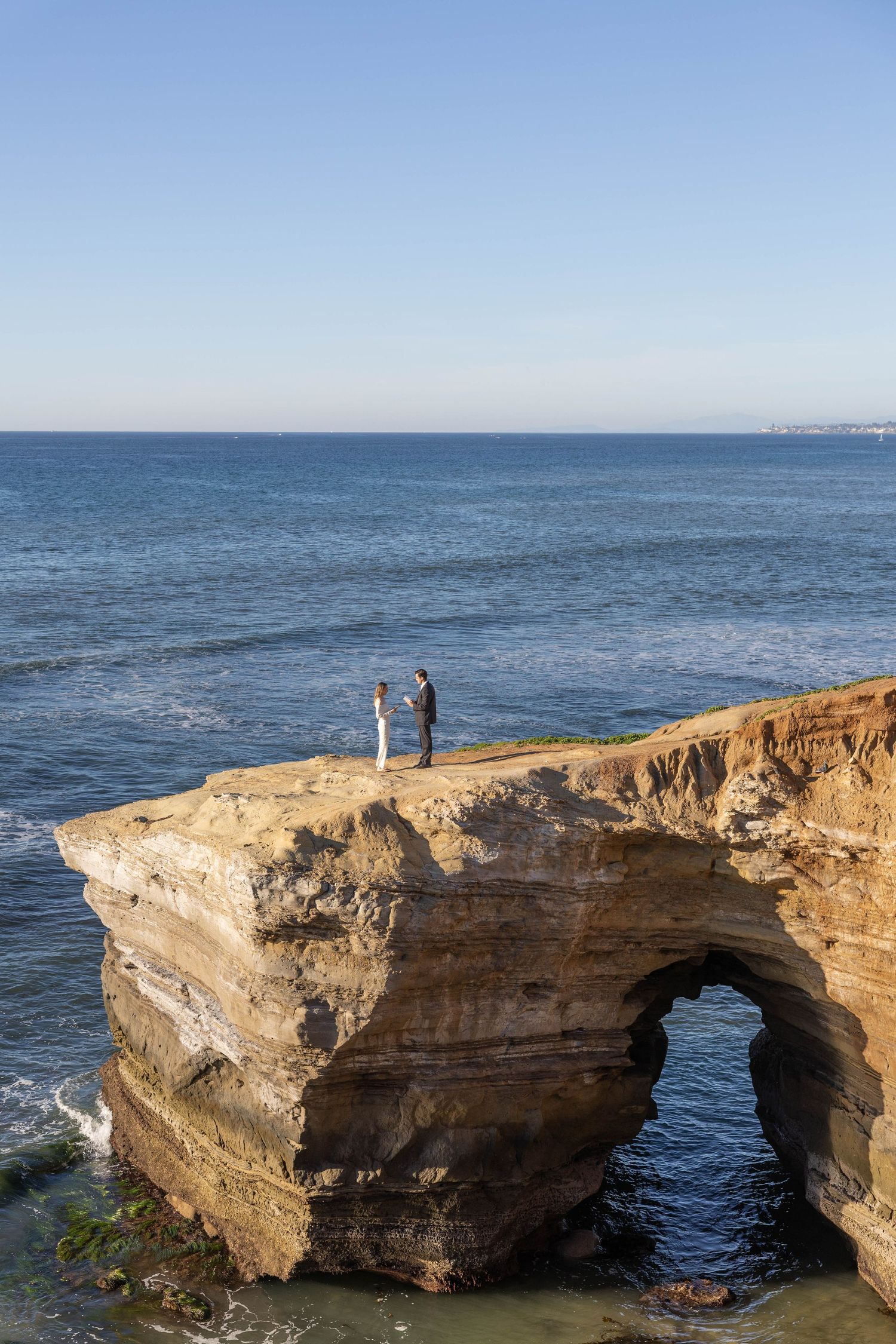 Bride and groom exchange their vows at this elopement at Sunset Cliffs in San Diego, California