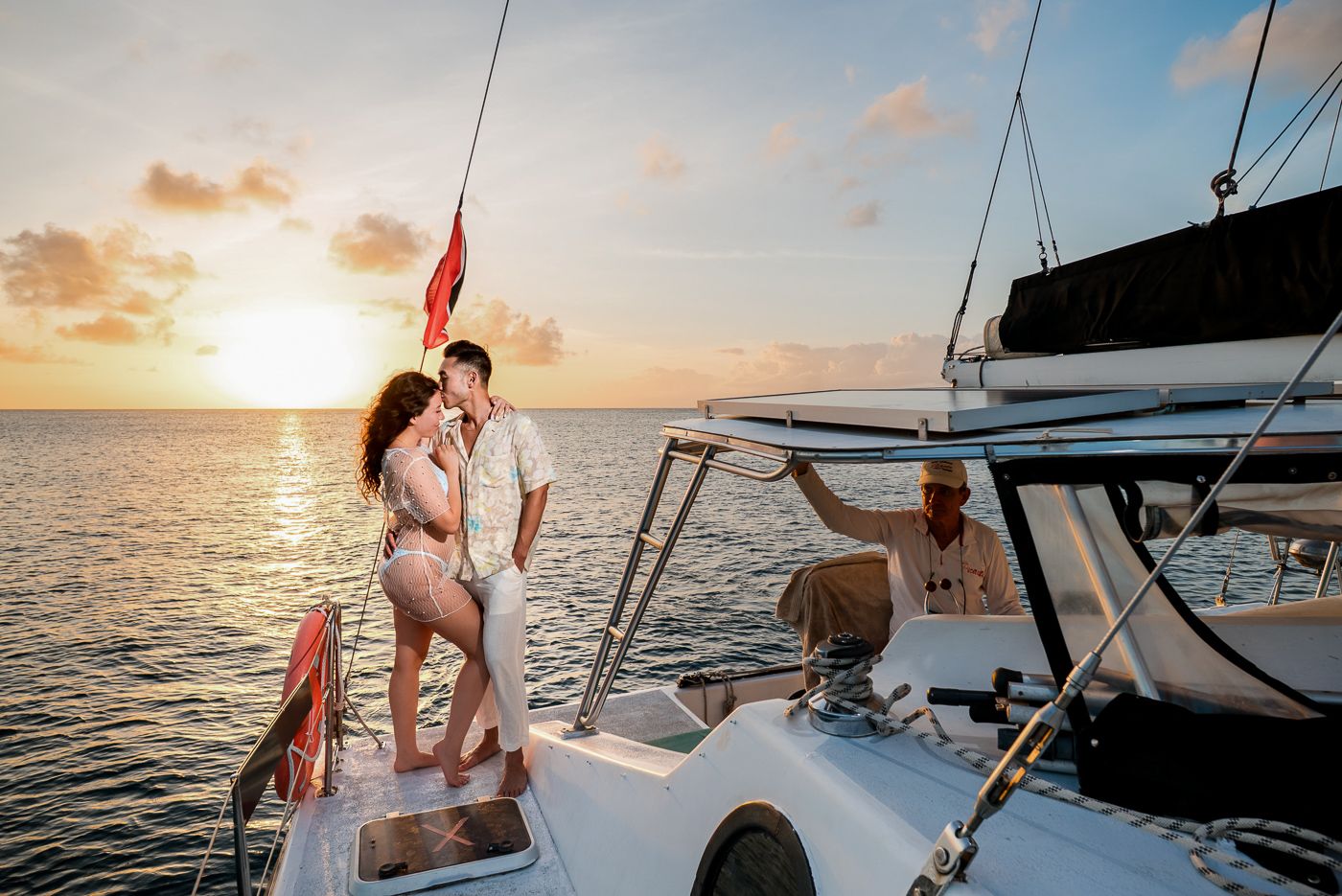Caribbean wedding photographers Celeste & Reece documenting the couple’s sunset cruise on a catamaran