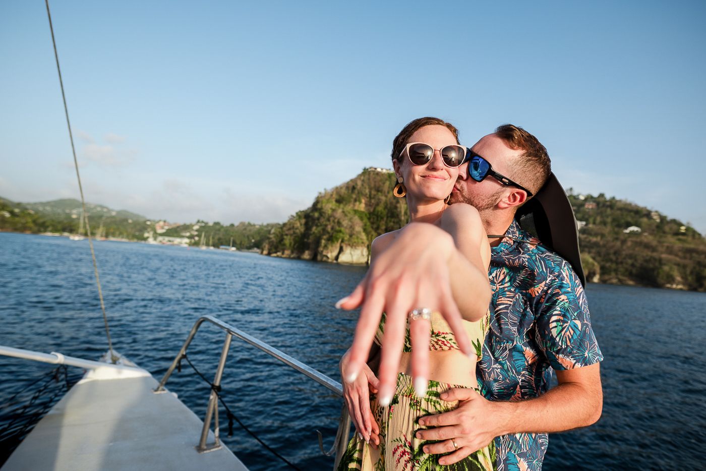 Caribbean wedding photographers Celeste and Reece capturing the couple on catamaran for their post wedding sunset cruise at sandals resorts