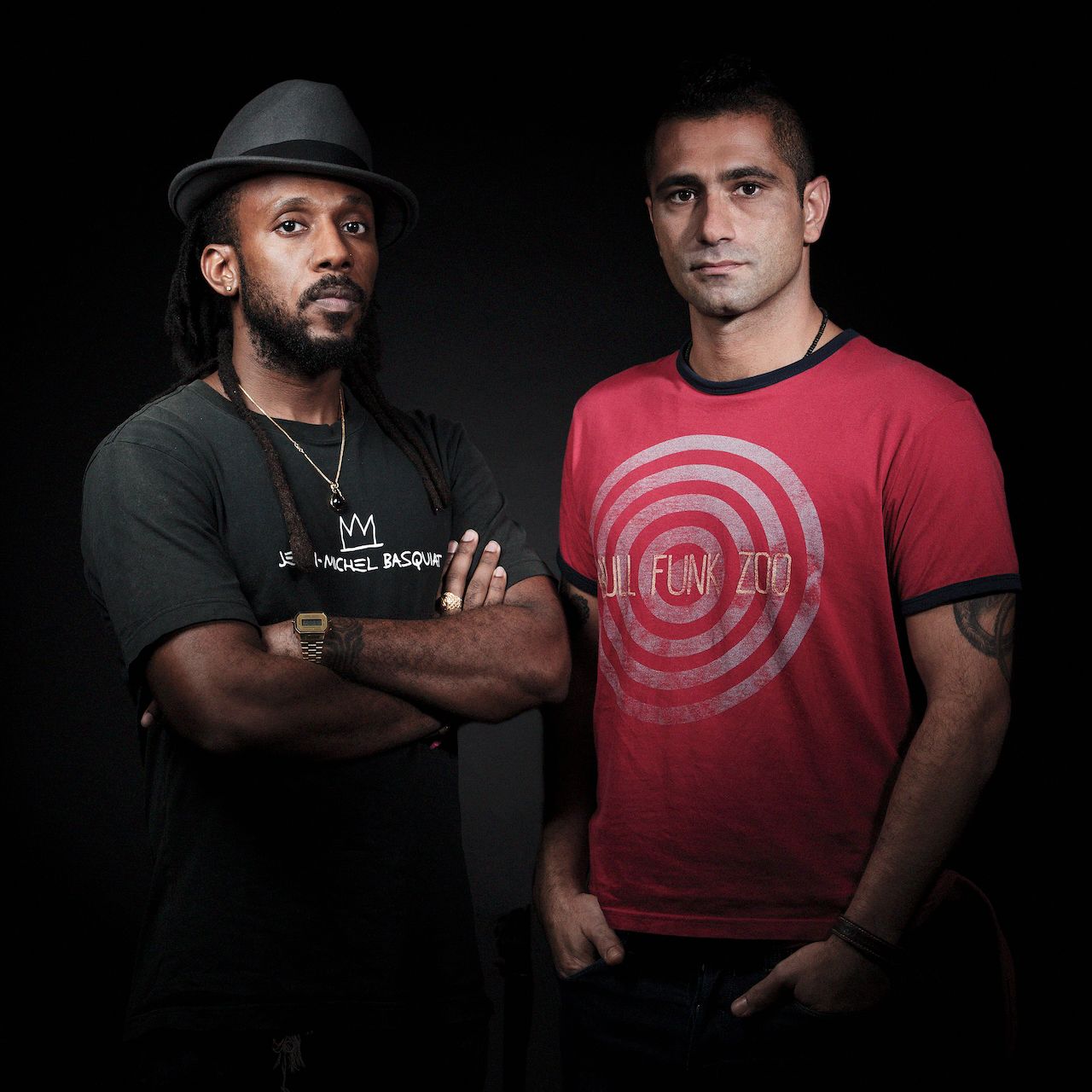 Group portrait of people wearing casual clothing against dark background.Portrait Photographer in Ontario