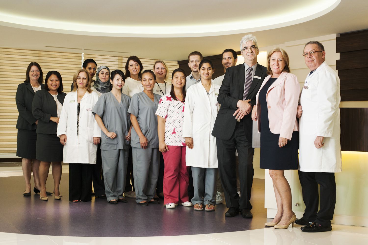 Large group of medical professionals standing together in a hospital hallway. Commercial Photographer in Guelph Ontario
