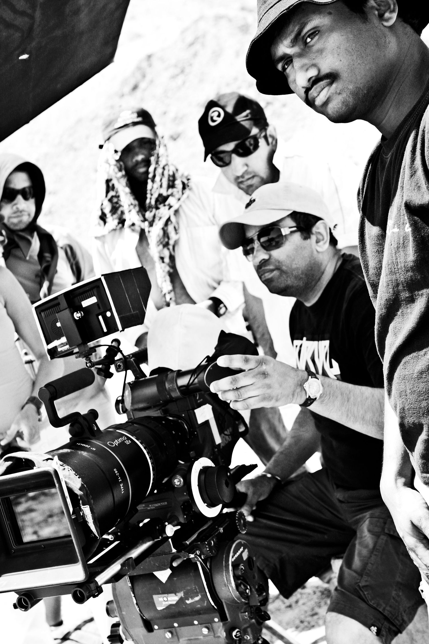 Black and white collage of photographers working with various camera equipment. Commercial Photographer in Guelph and surrounding areas