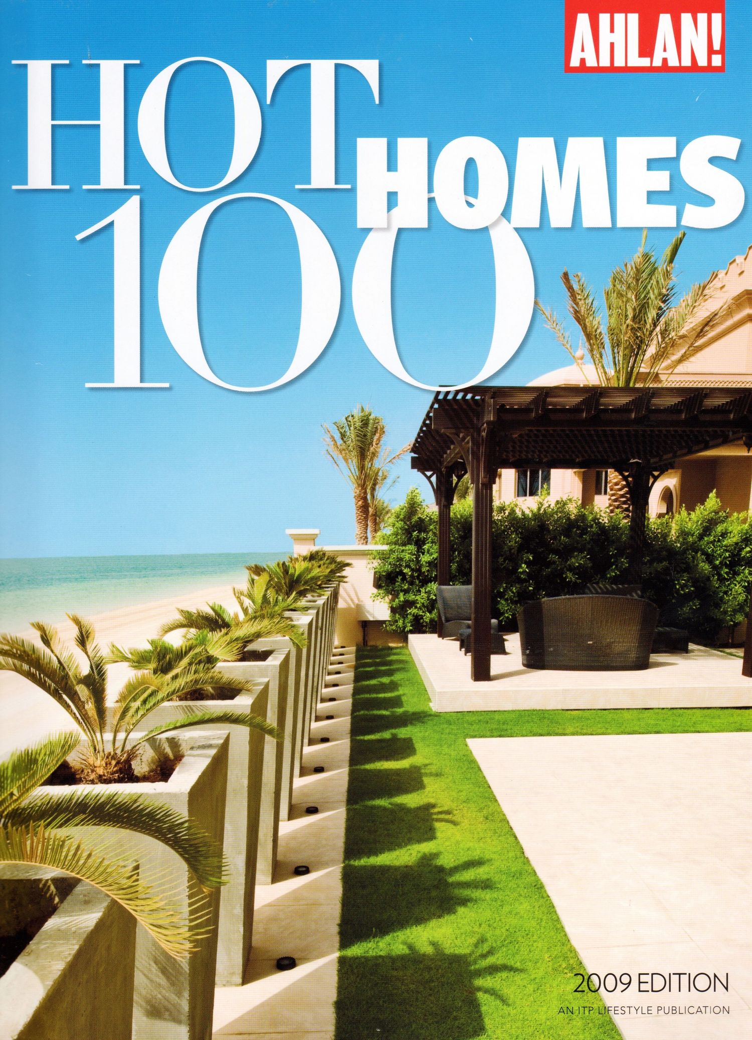 Luxury beachfront property magazine covers showing modern villas with palm trees and ocean views.  Editorial Photographer in Ontario, Canada