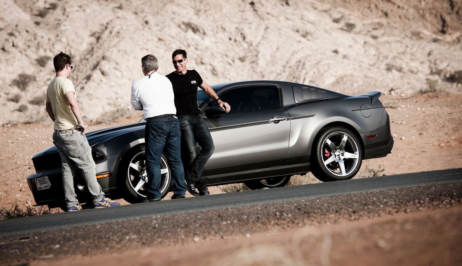 Group of sports cars parked on a desert road during a car meetup. car photography in ontario