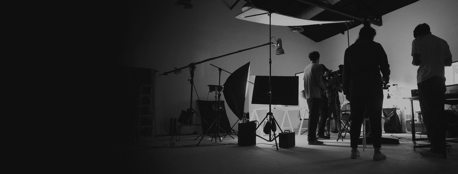 Silhouettes of photography equipment and people in a dark studio setting.photography workshops in guelph and surrounding areas