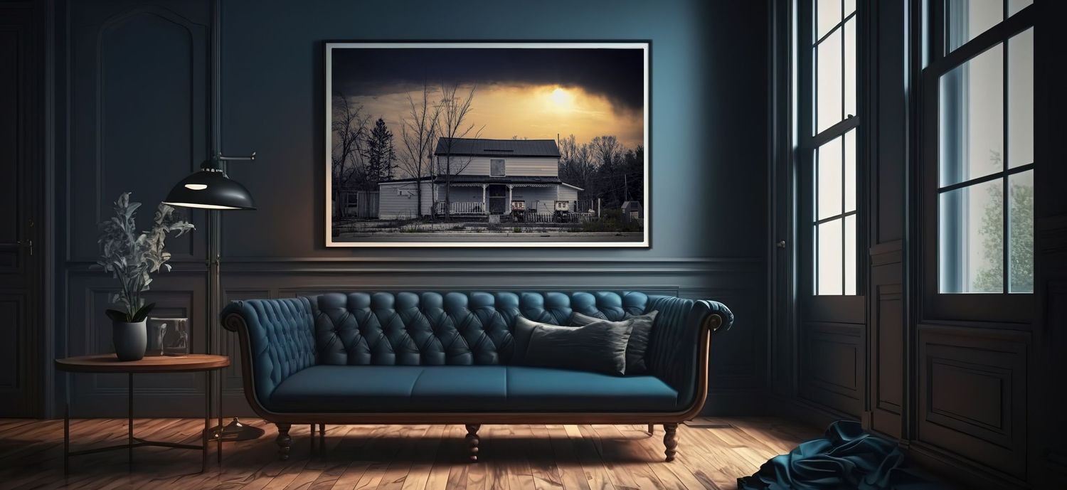 Elegant living room interior with blue velvet sofa and framed artwork against dark walls. Printing Services in Guelph, Kitchener, Waterloo a