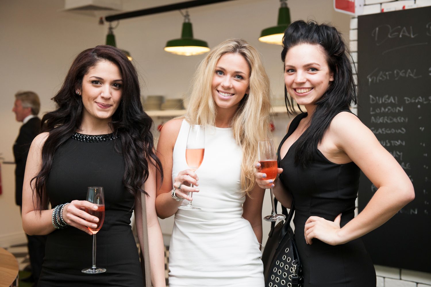 Group of friends enjoying drinks and socializing at a casual gathering. event photographer in guelph ontario
