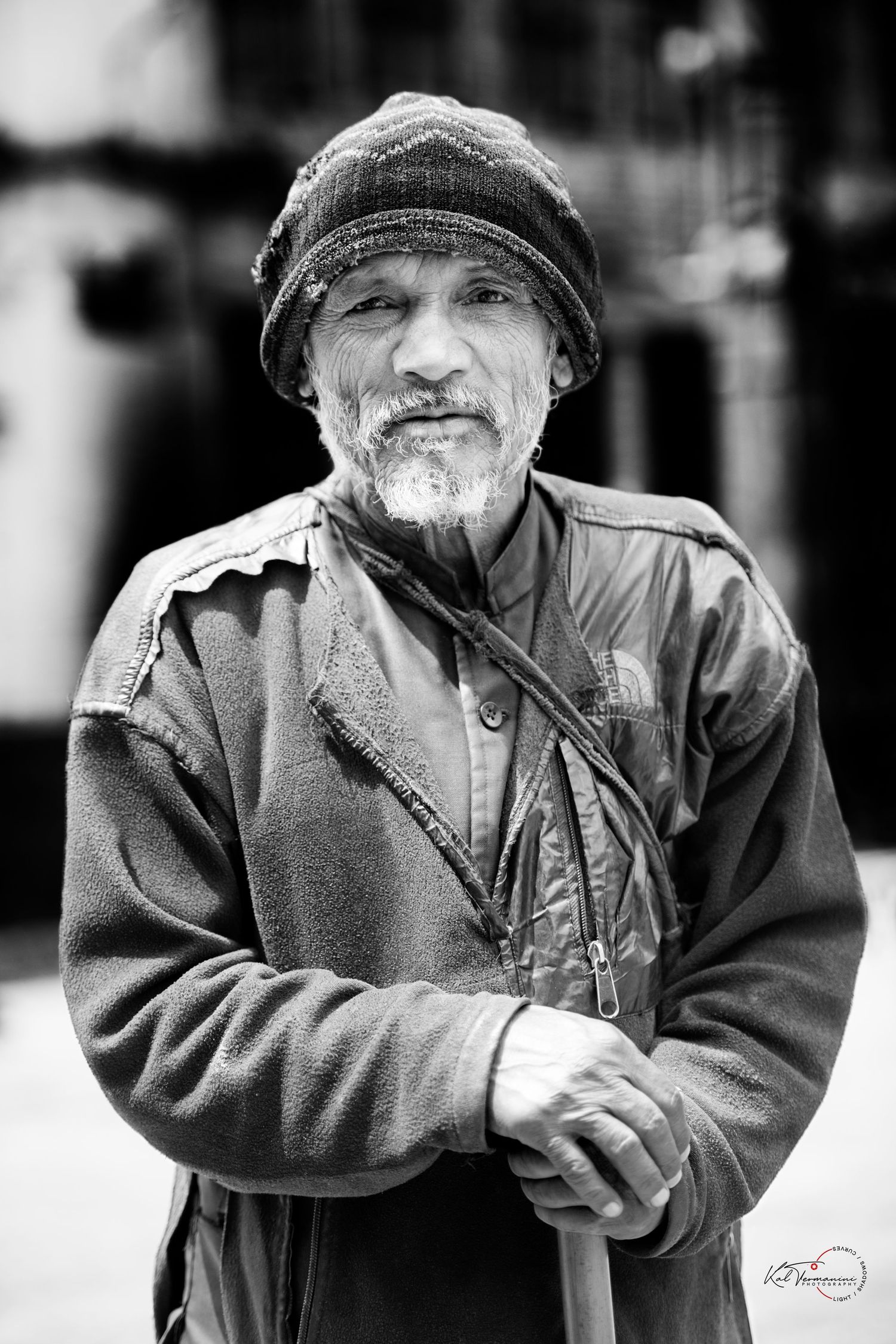 Black and white portrait of person in winter coat and hat looking to the side.Portrait Photographer in Ontario