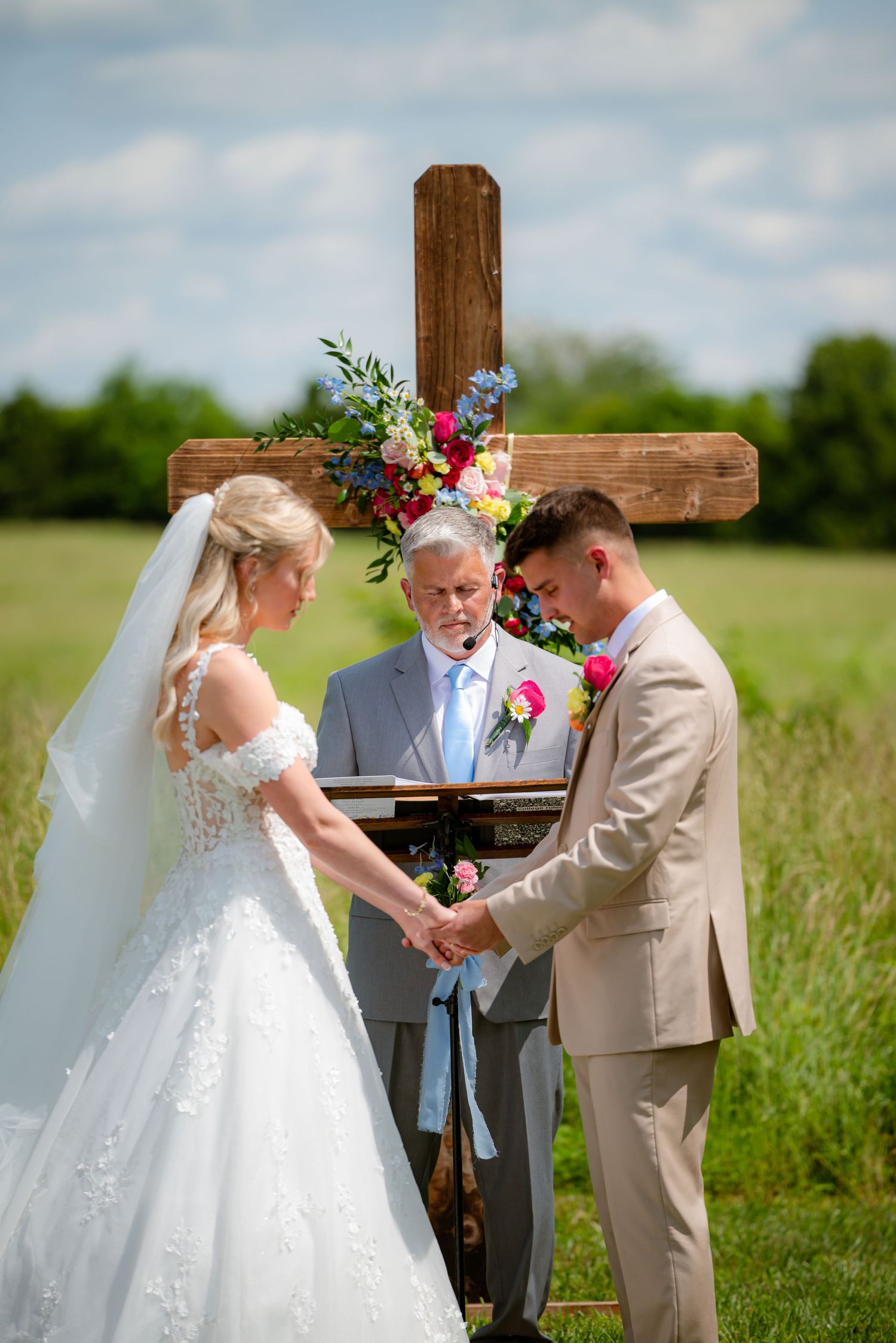 Bride and groom at the ceremony at alter, surrounded by nature.