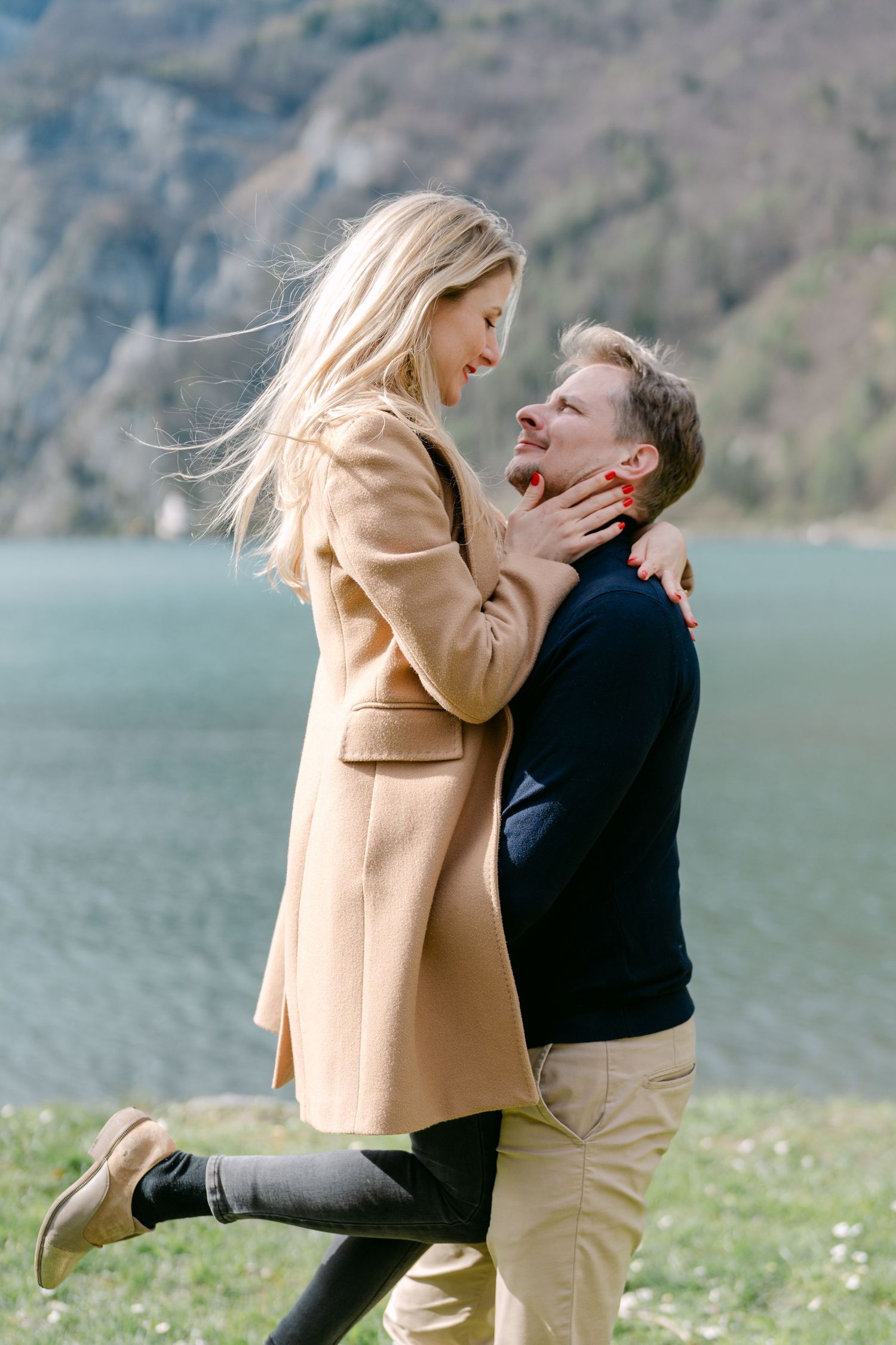 Proposal sequence captured in sunny mountain meadow with lake view.