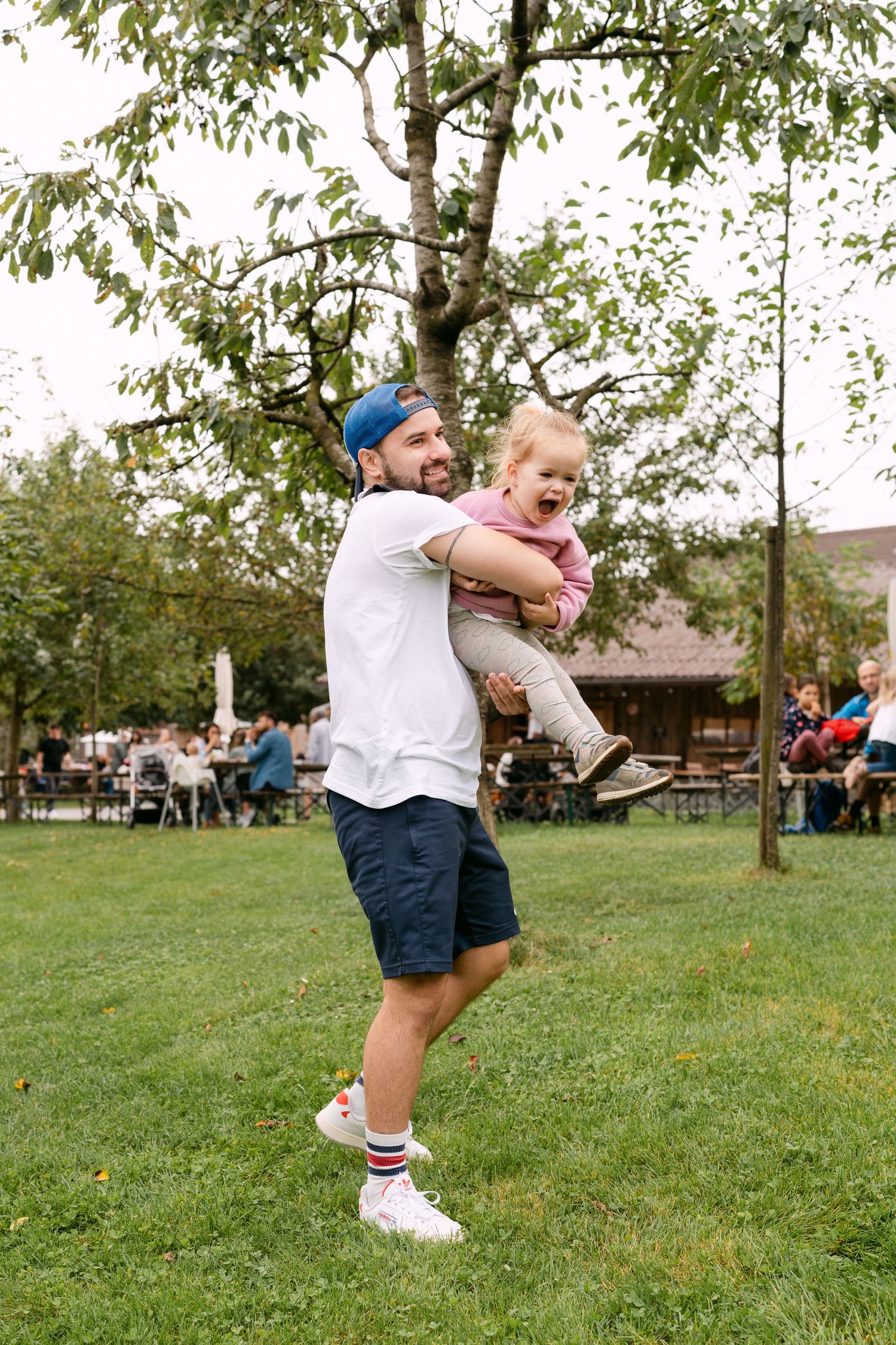 Dynamic action shots of people playing and running on grass in a park setting.