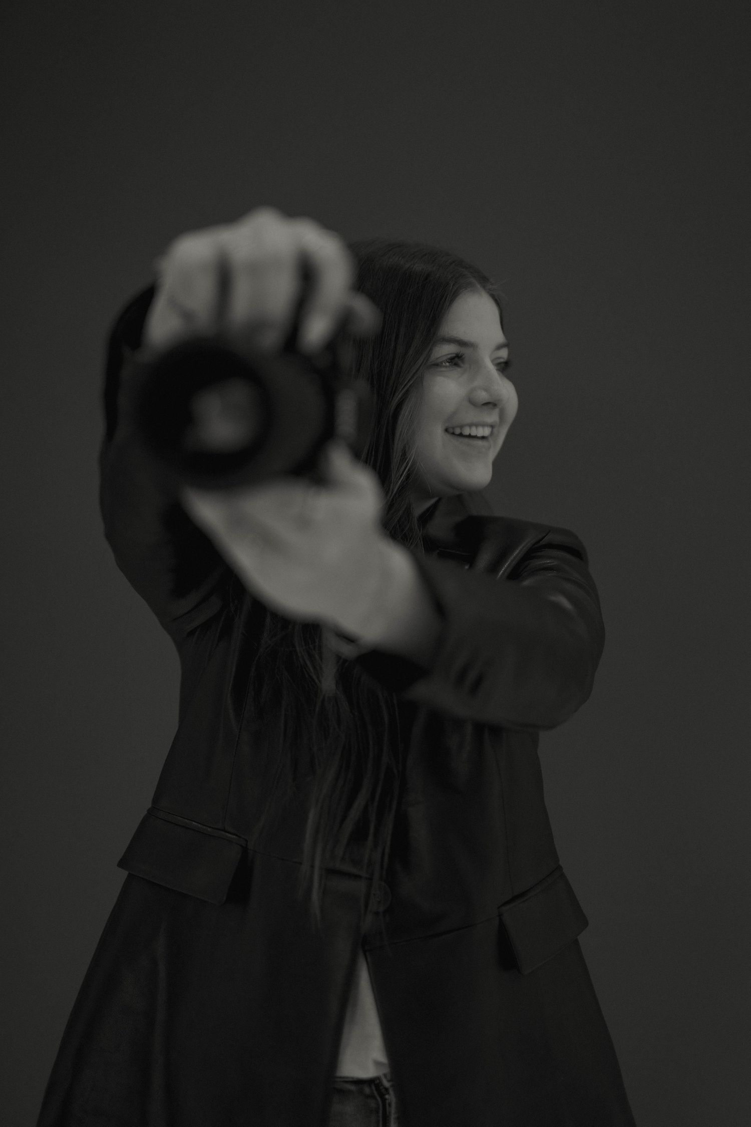 Dramatic black and white portrait series showing expressive movement and gestures.