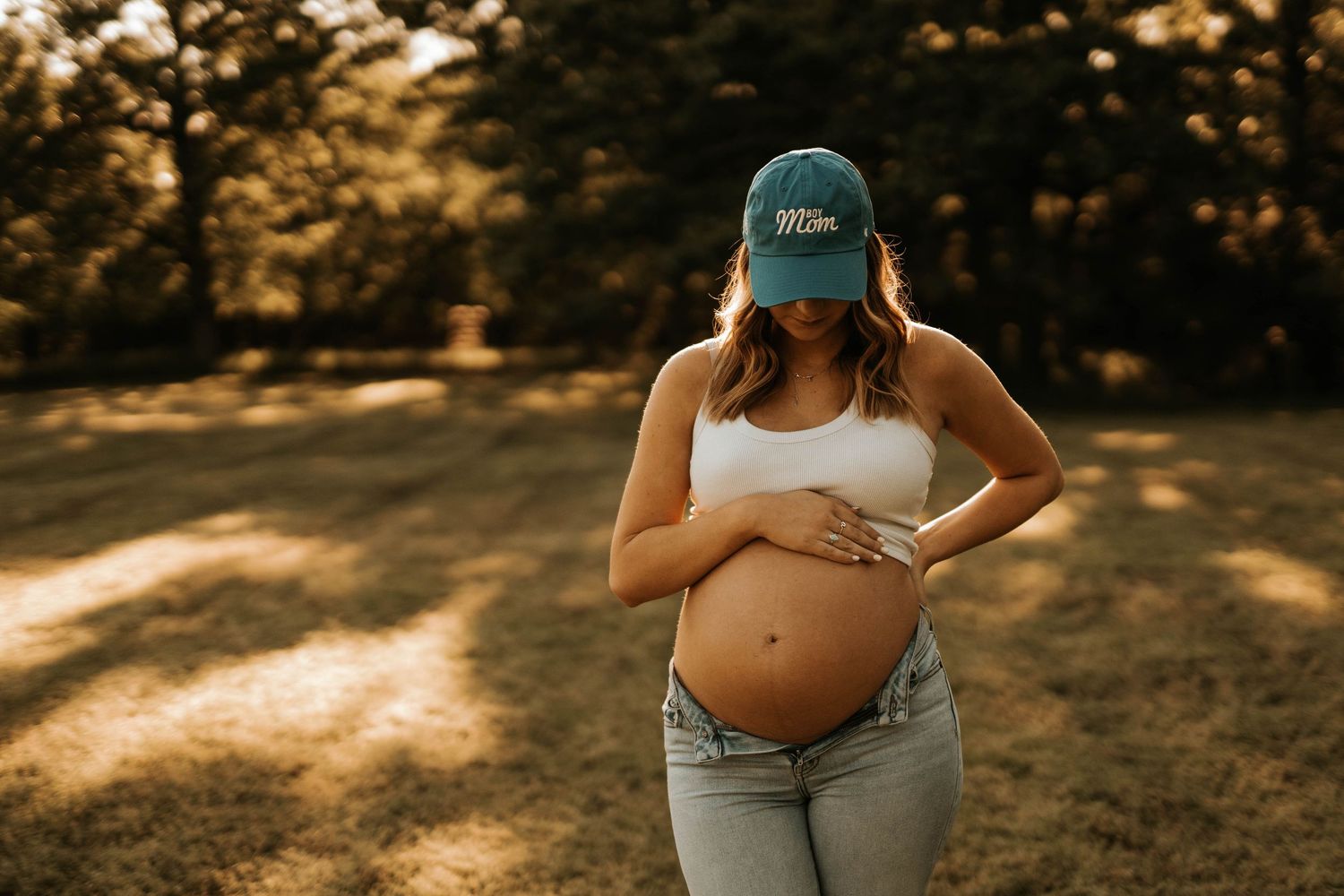 Various detail shots highlighting a maternity photo session in jeans and casual wear.