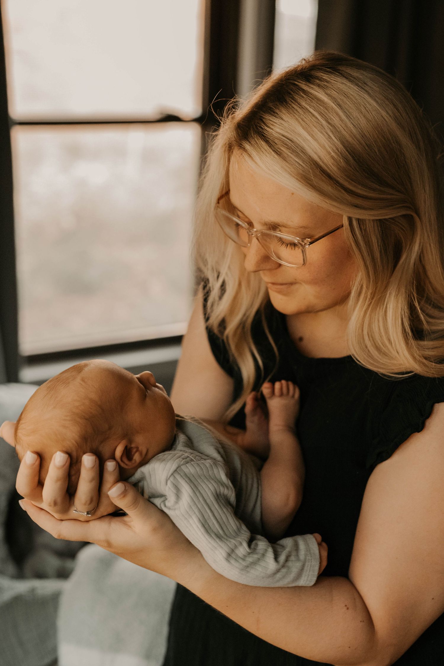 Tender moment of nurturing care captured in soft natural lighting.