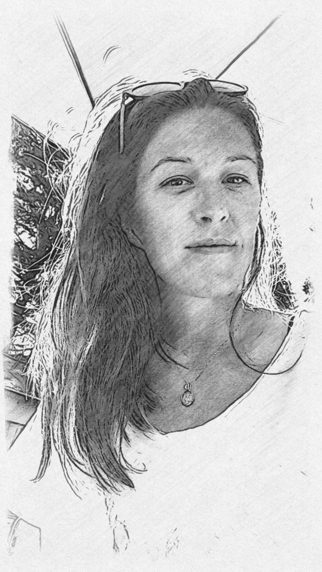 A black and white pencil sketch portrait showing long windblown hair and delicate features.