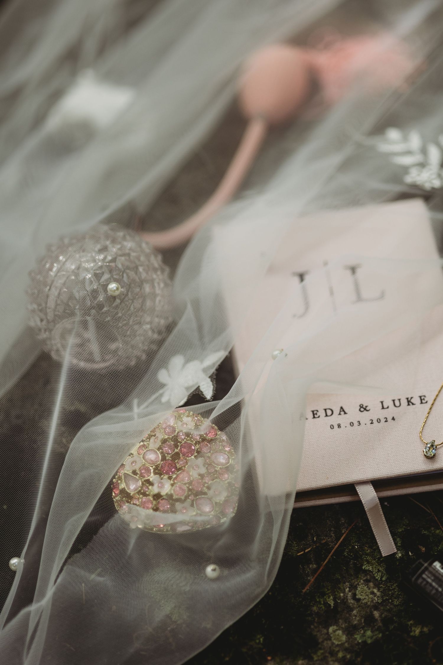 Wedding invitation details and confetti packets arranged artistically on a blurred background.