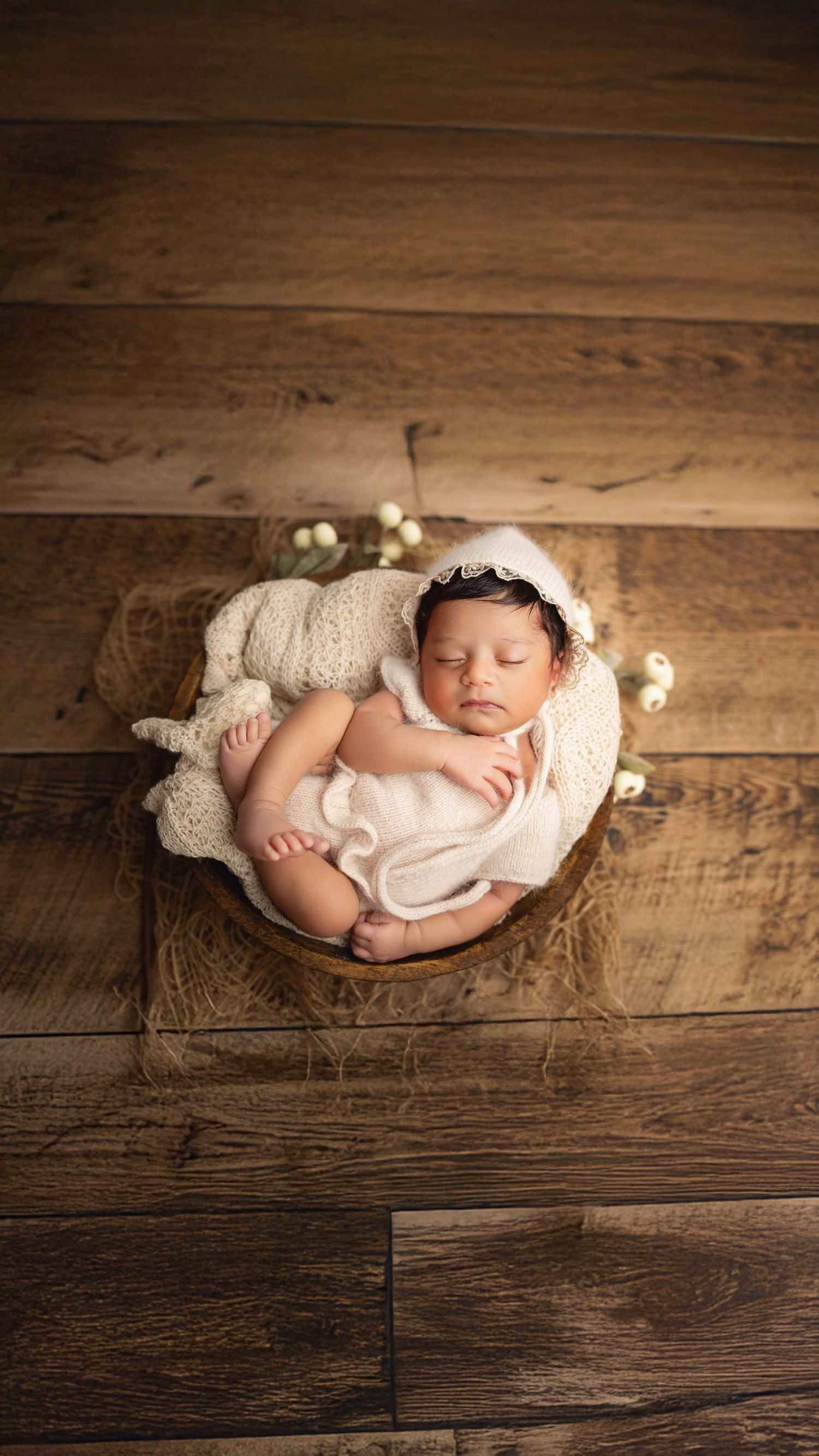 beautiful baby girl posed in bowl prop during a seattle newborn photography session