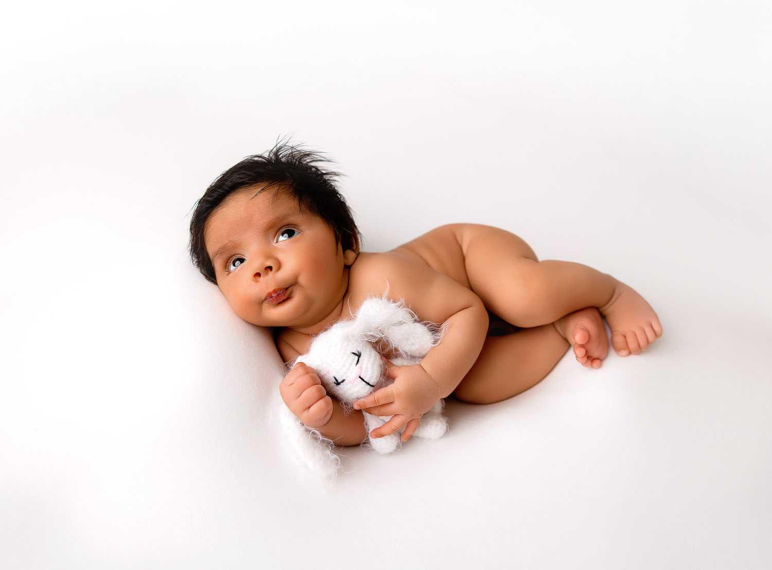 Collection of artistic black and white newborn baby photos on white background.
