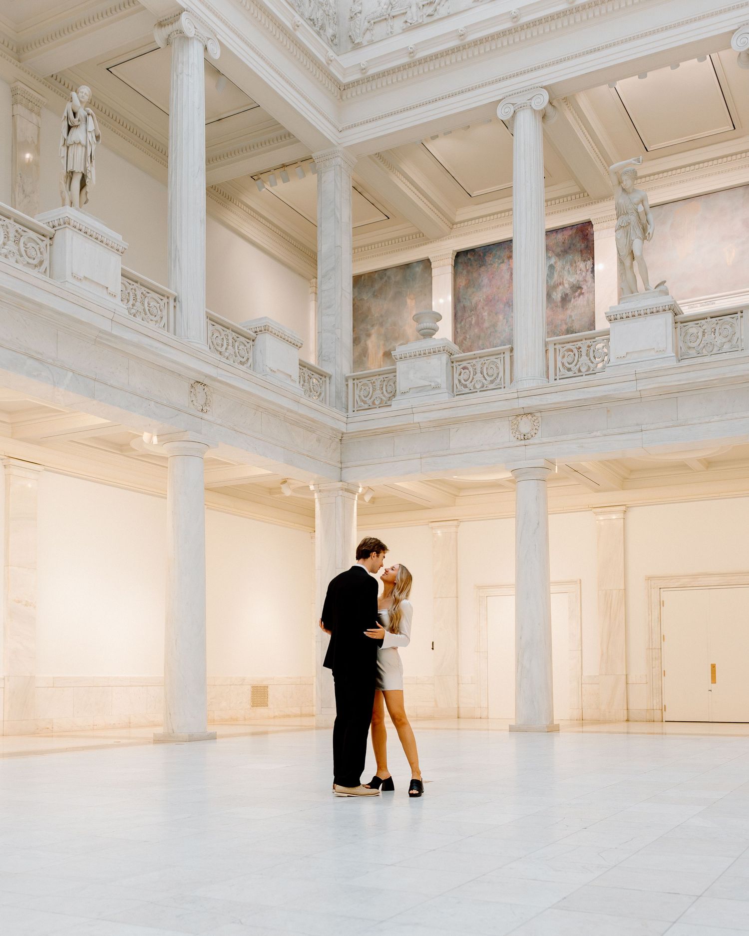 Elegant photo series in a bright white classical interior with ornate architectural details.