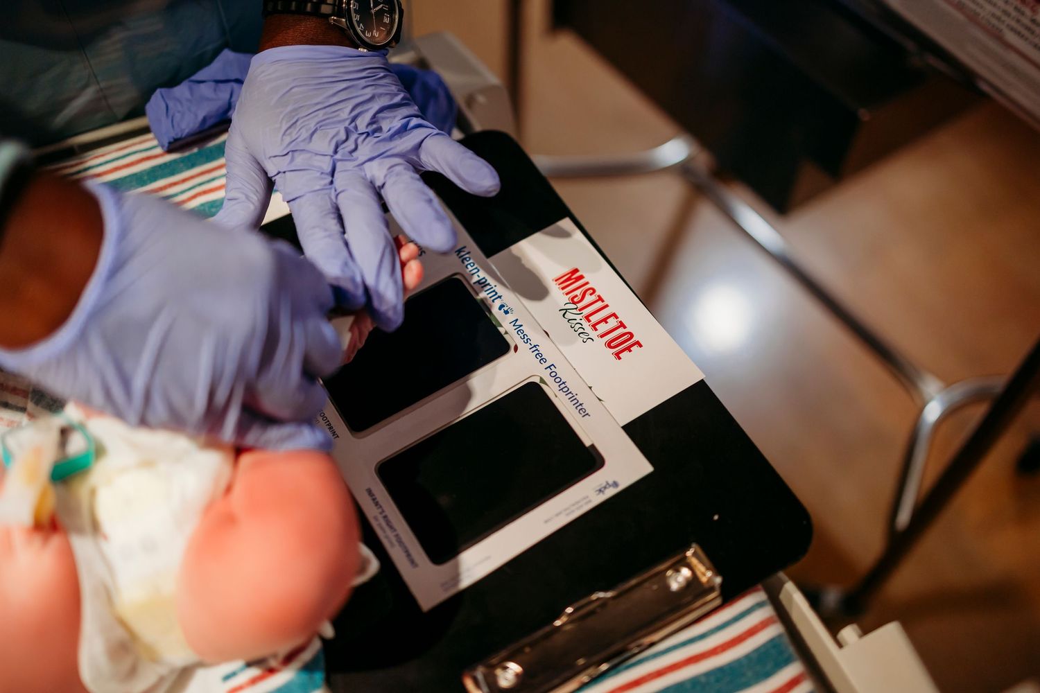 Medical staff attend to a newborn baby in a hospital setting.