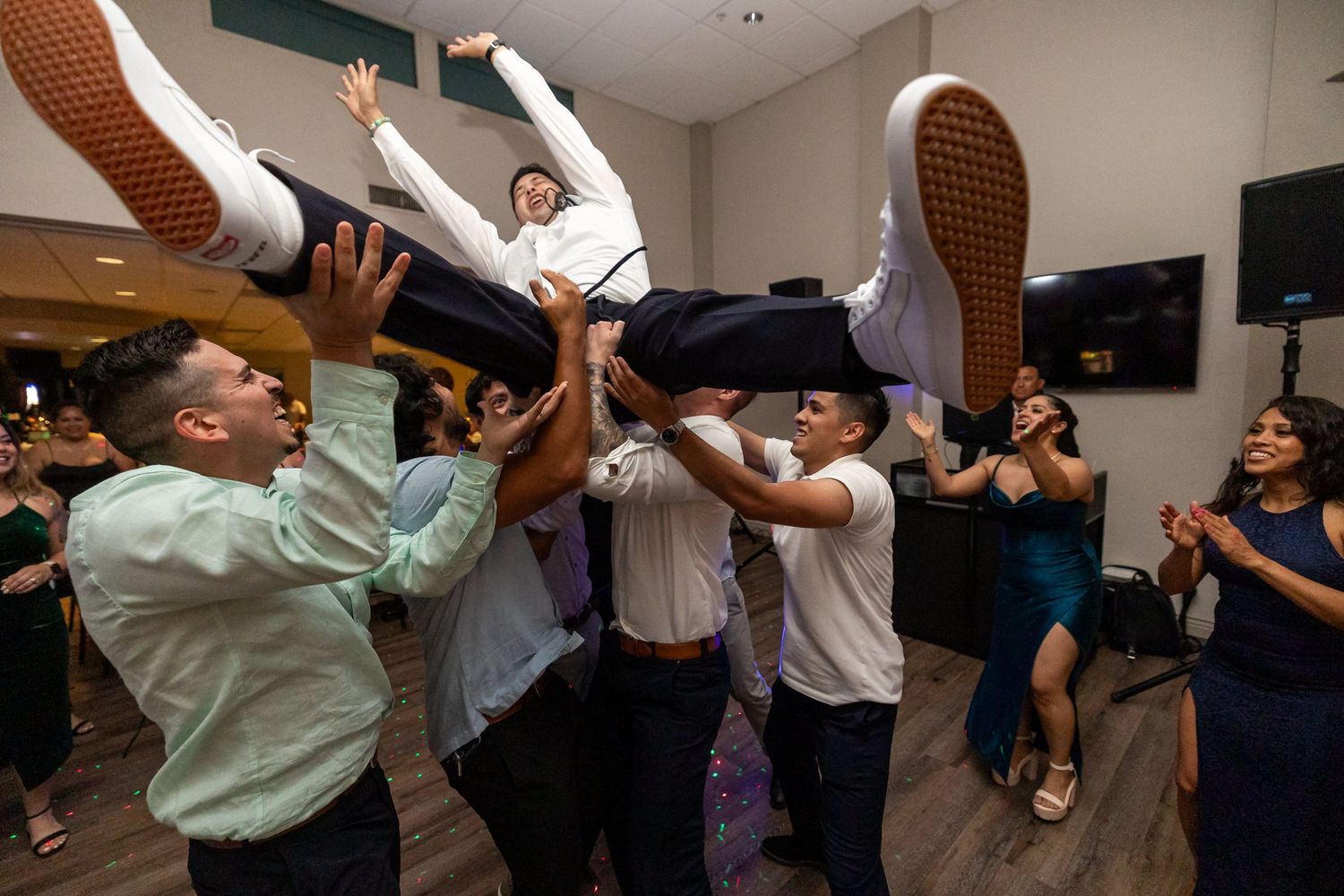 People dancing and celebrating at a reception in Glendale