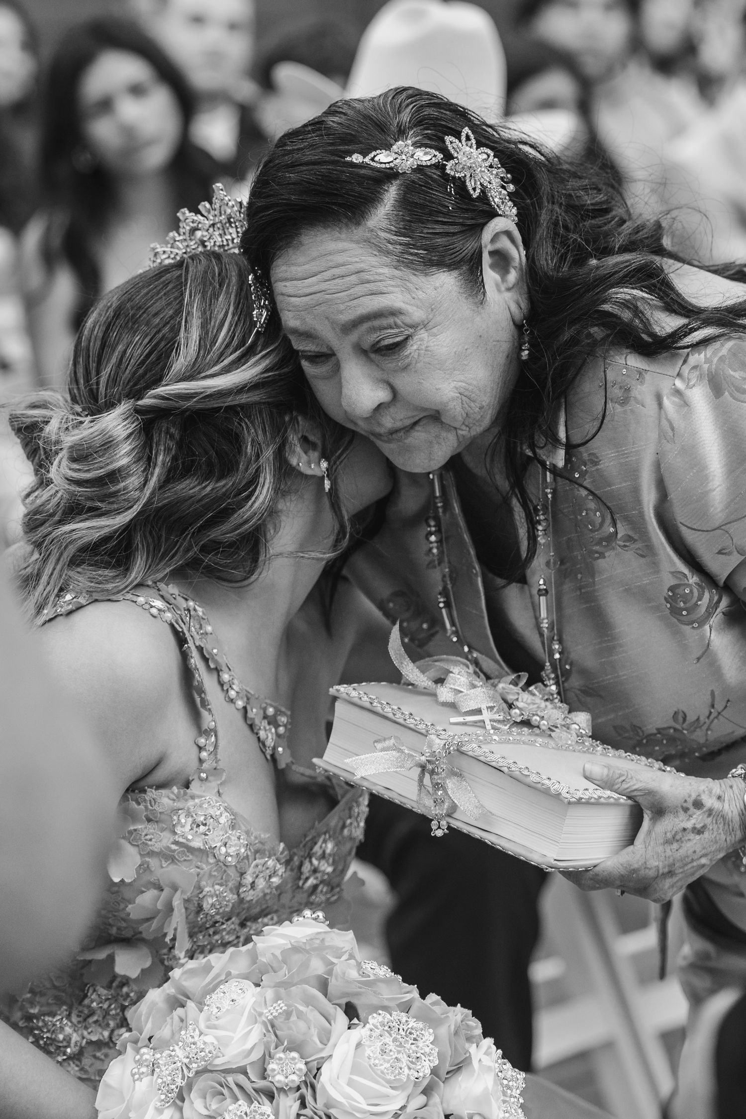 Black and white candid photo of traditional gift giving during quince ceremony in San Jacinto.