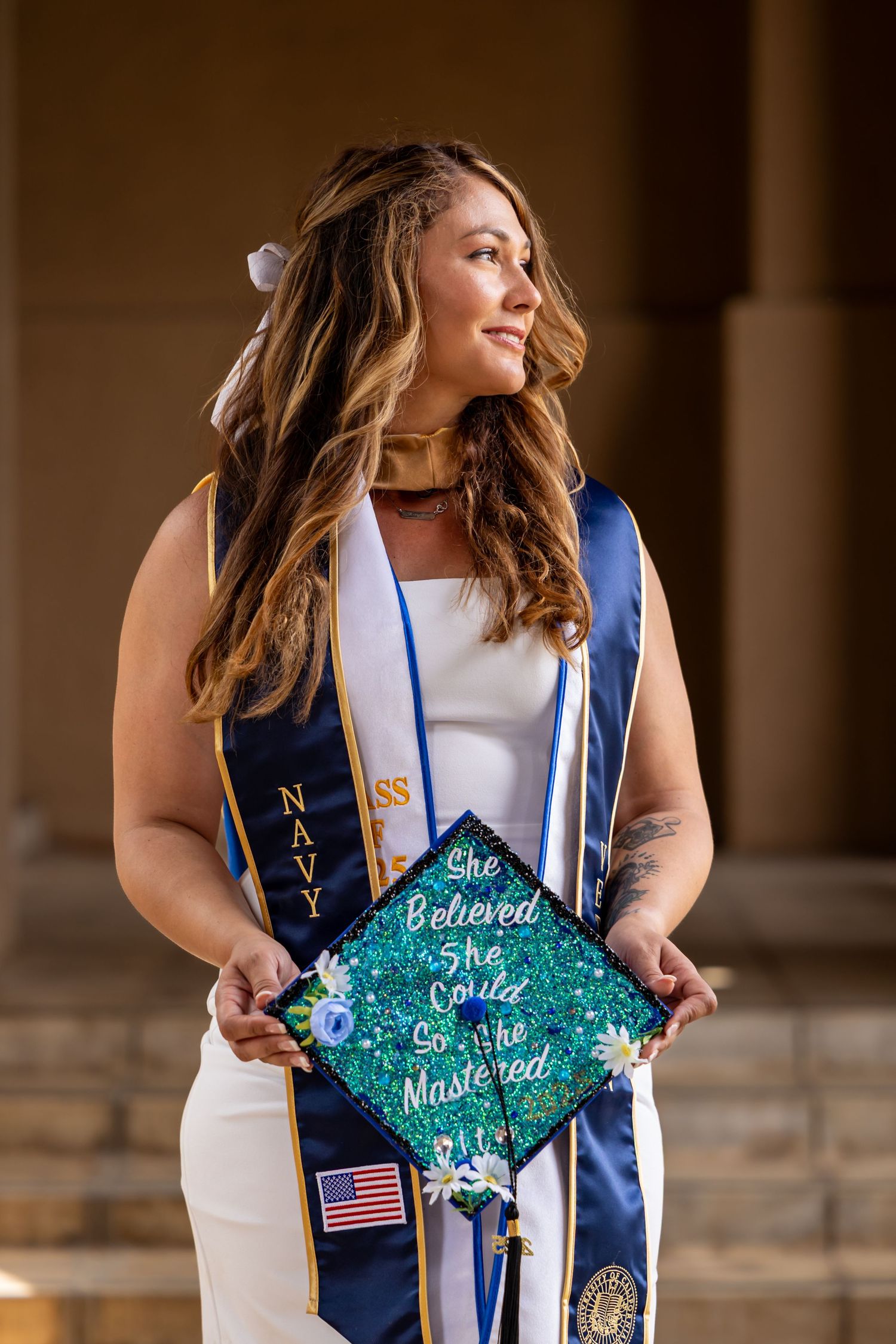 Graduate showing off decorated cap in Riverside.