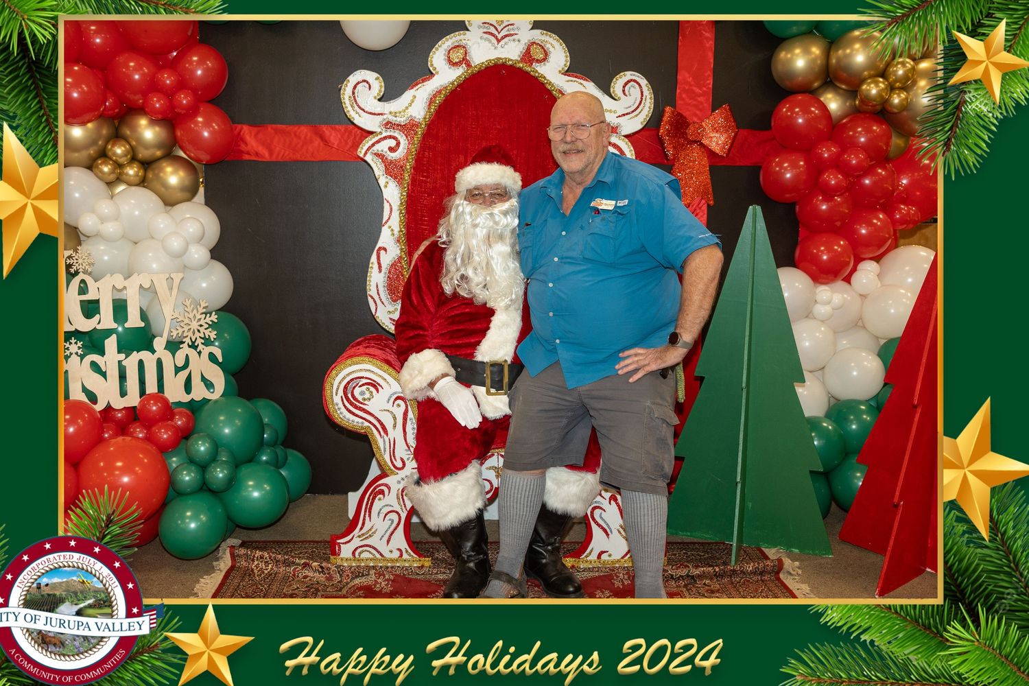 Holiday photo setup with ornate throne chair and festive balloon decorations.