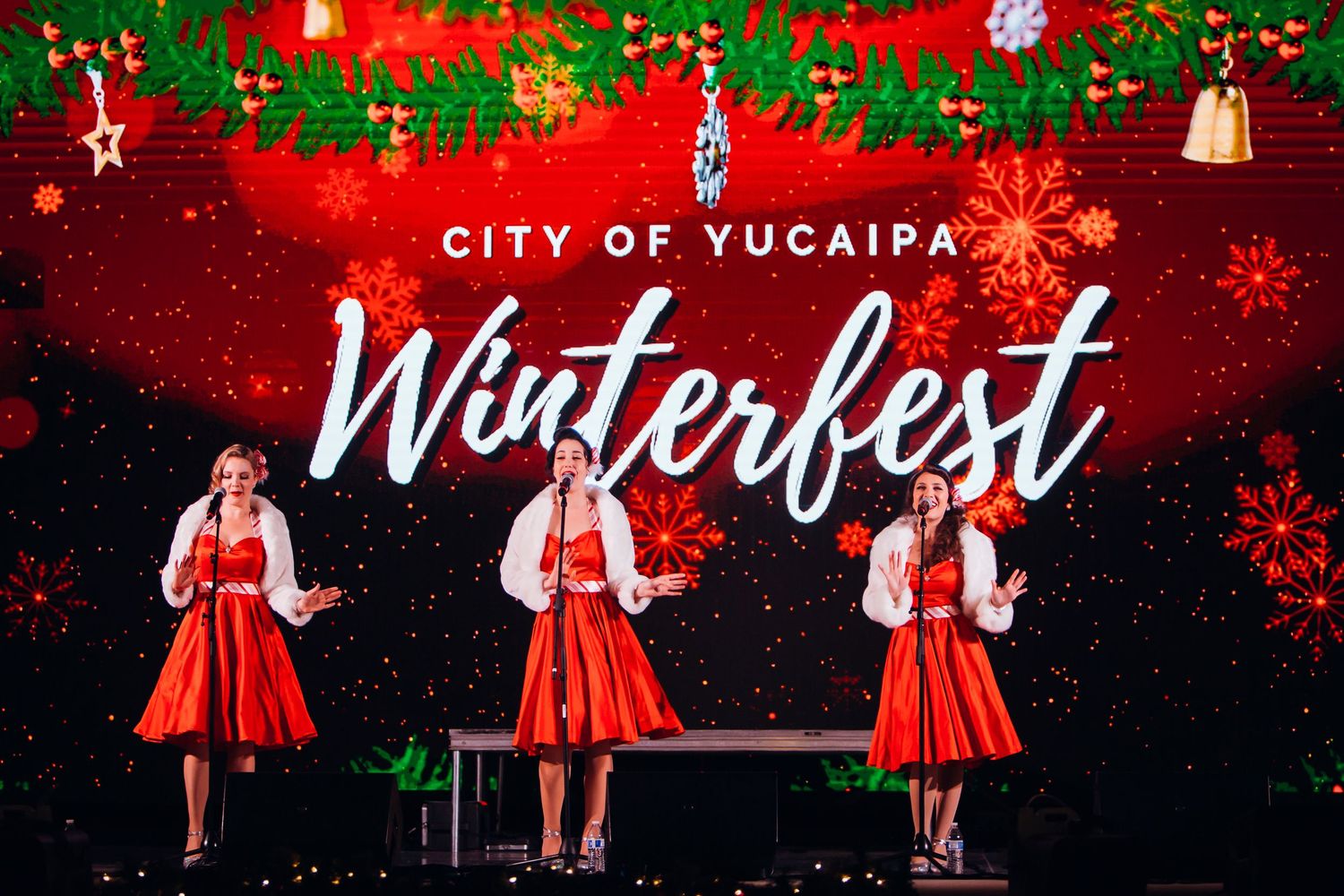 Red Christmas banners with festive decorations and snowy effects create a winterfest celebration theme.