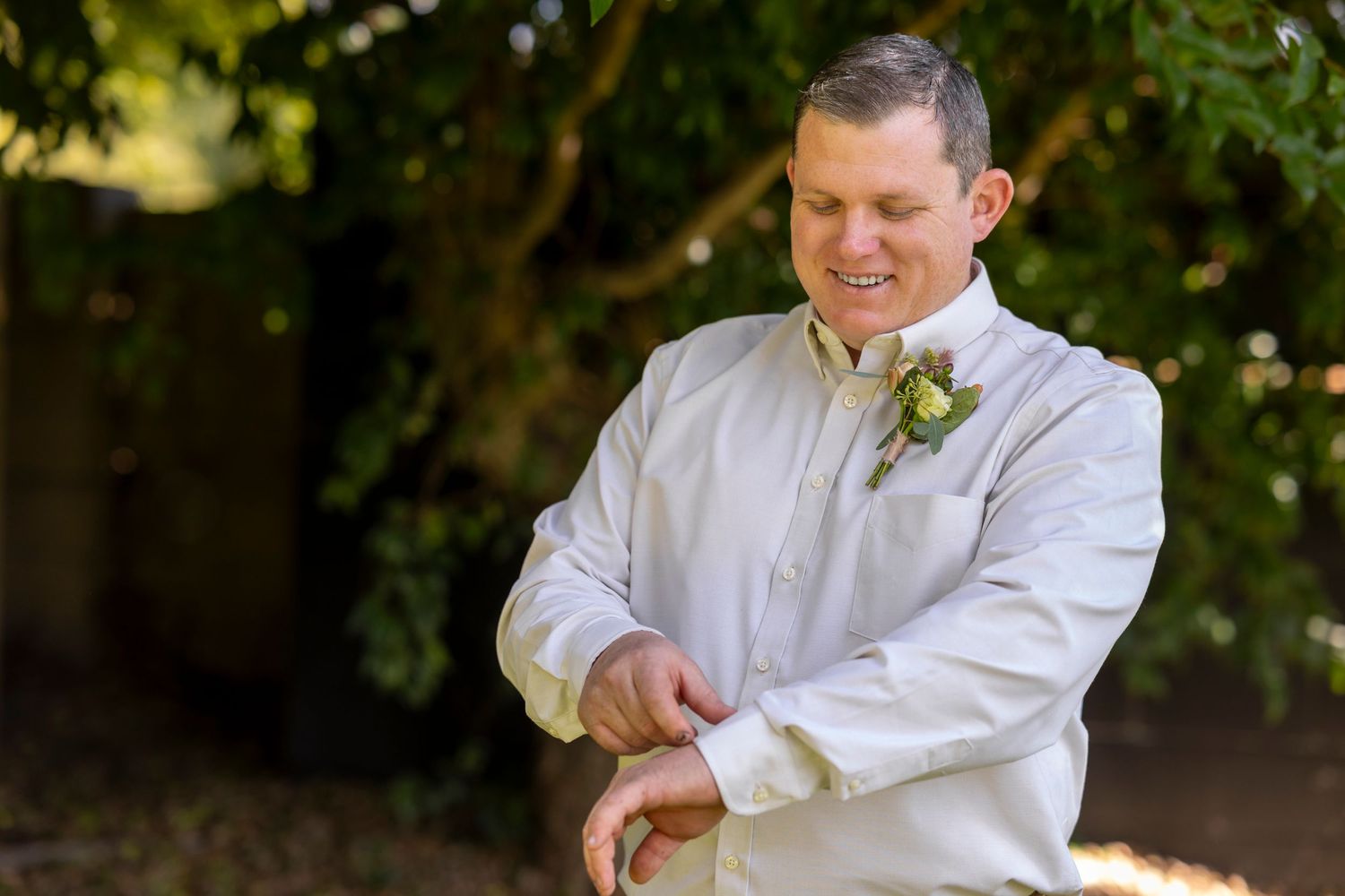 Wedding day preparation details with white boutonniere and formal attire.