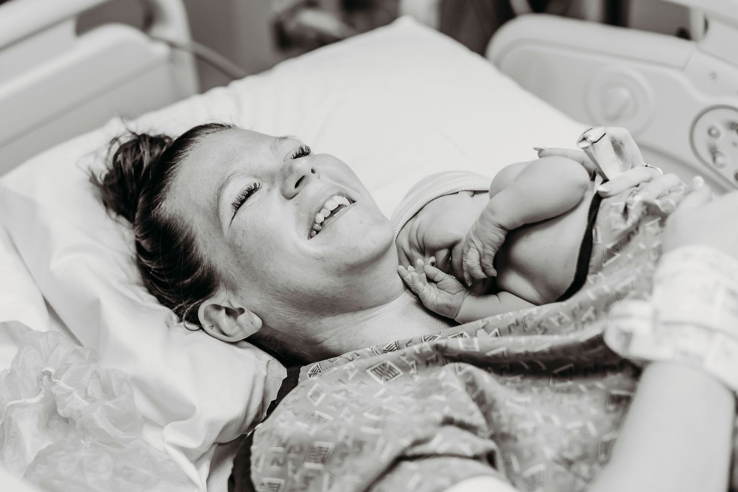 A joyful moment captured in a hospital bed.
