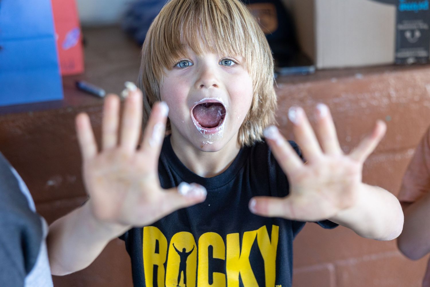 Excited expressions and hand gestures in casual portrait sequence.