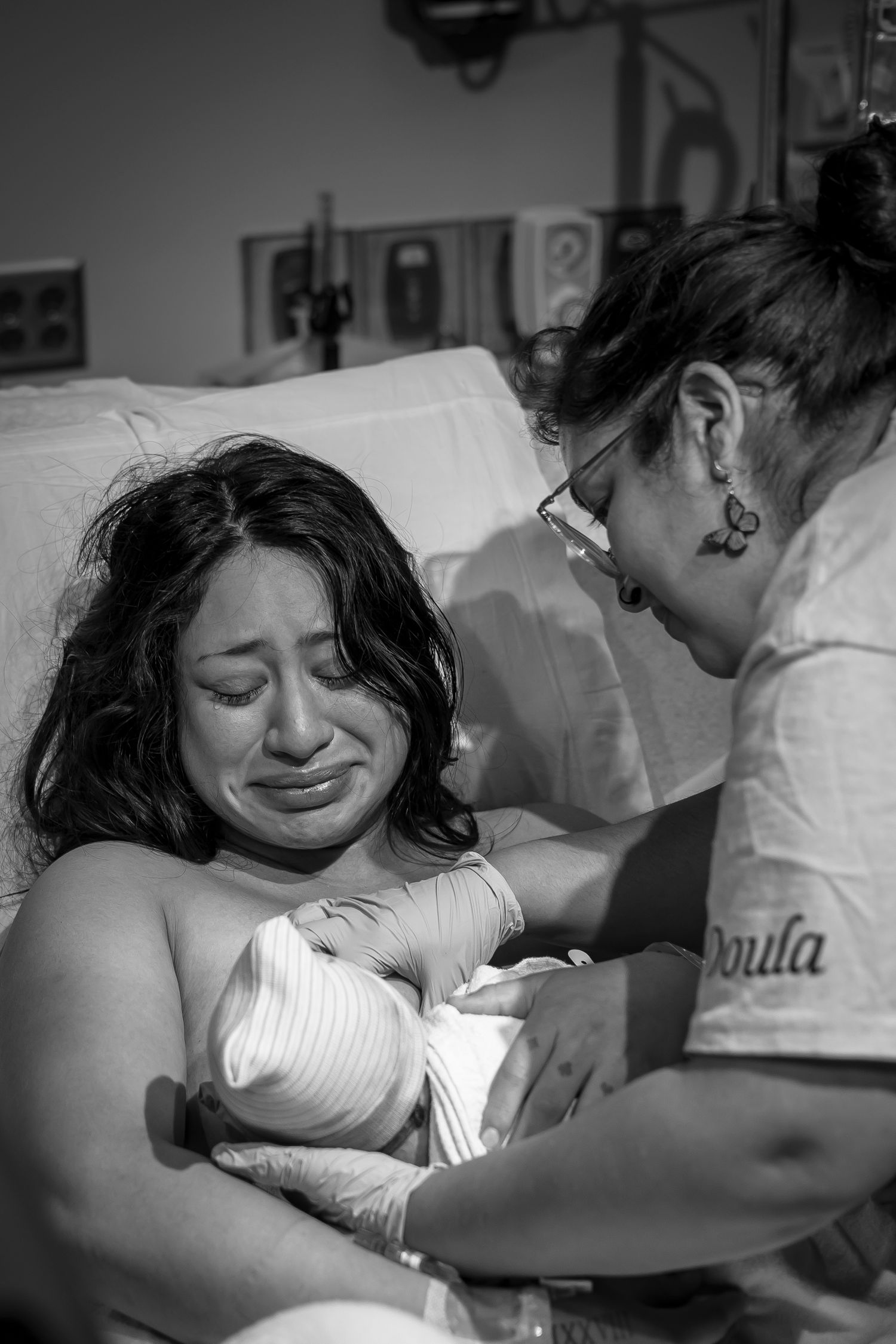 Emotional moments captured during hospital childbirth experience.